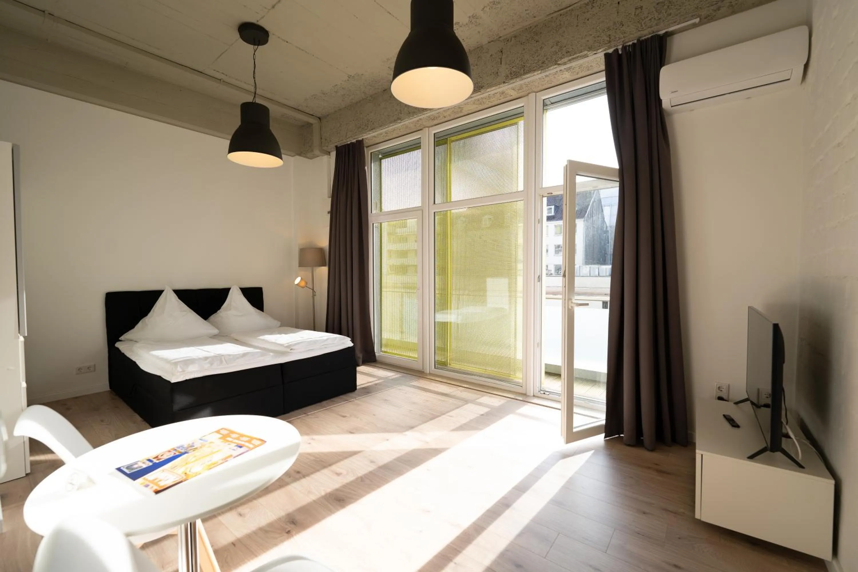 Bed in Das Loft Apartments