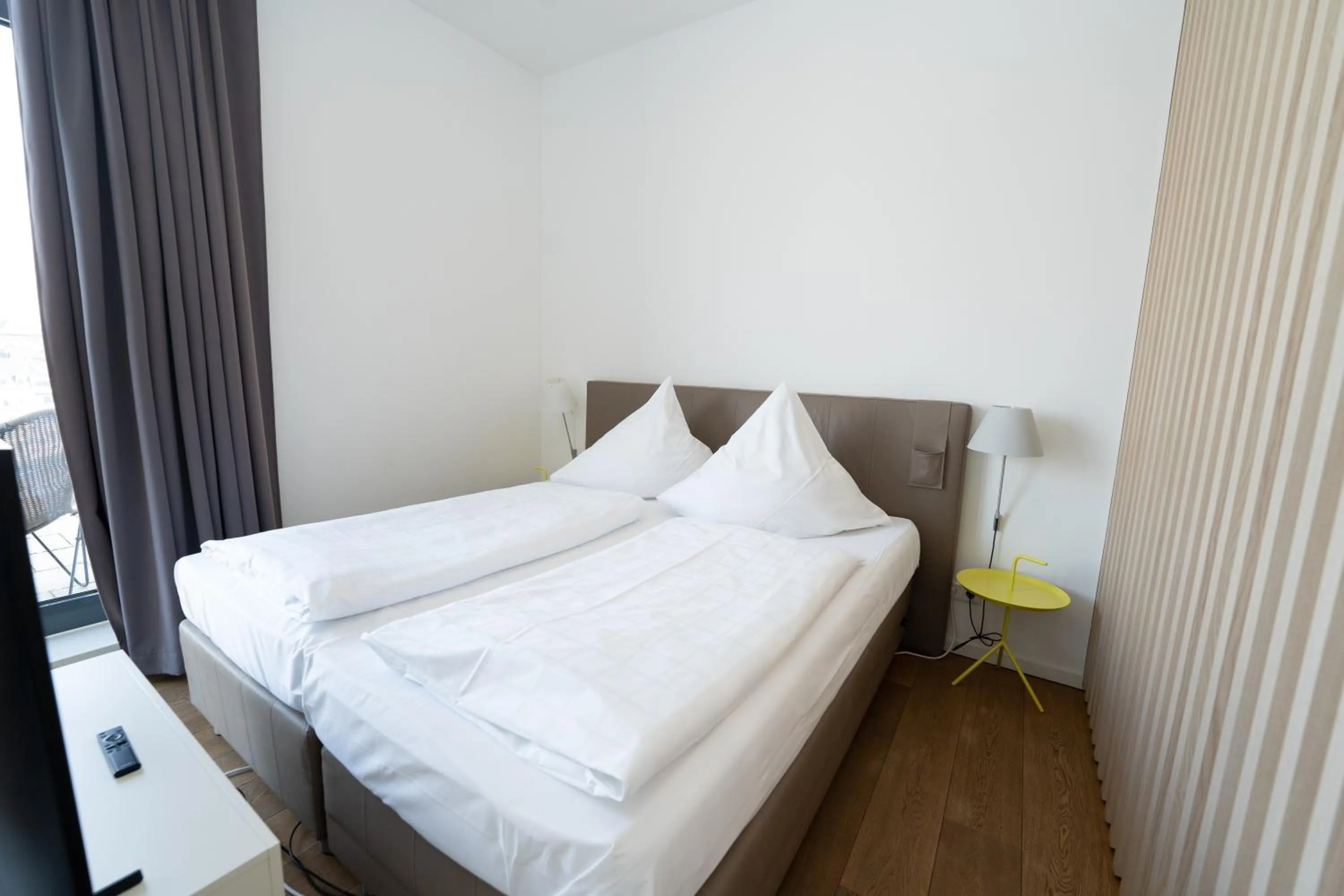 Bed in Das Loft Apartments