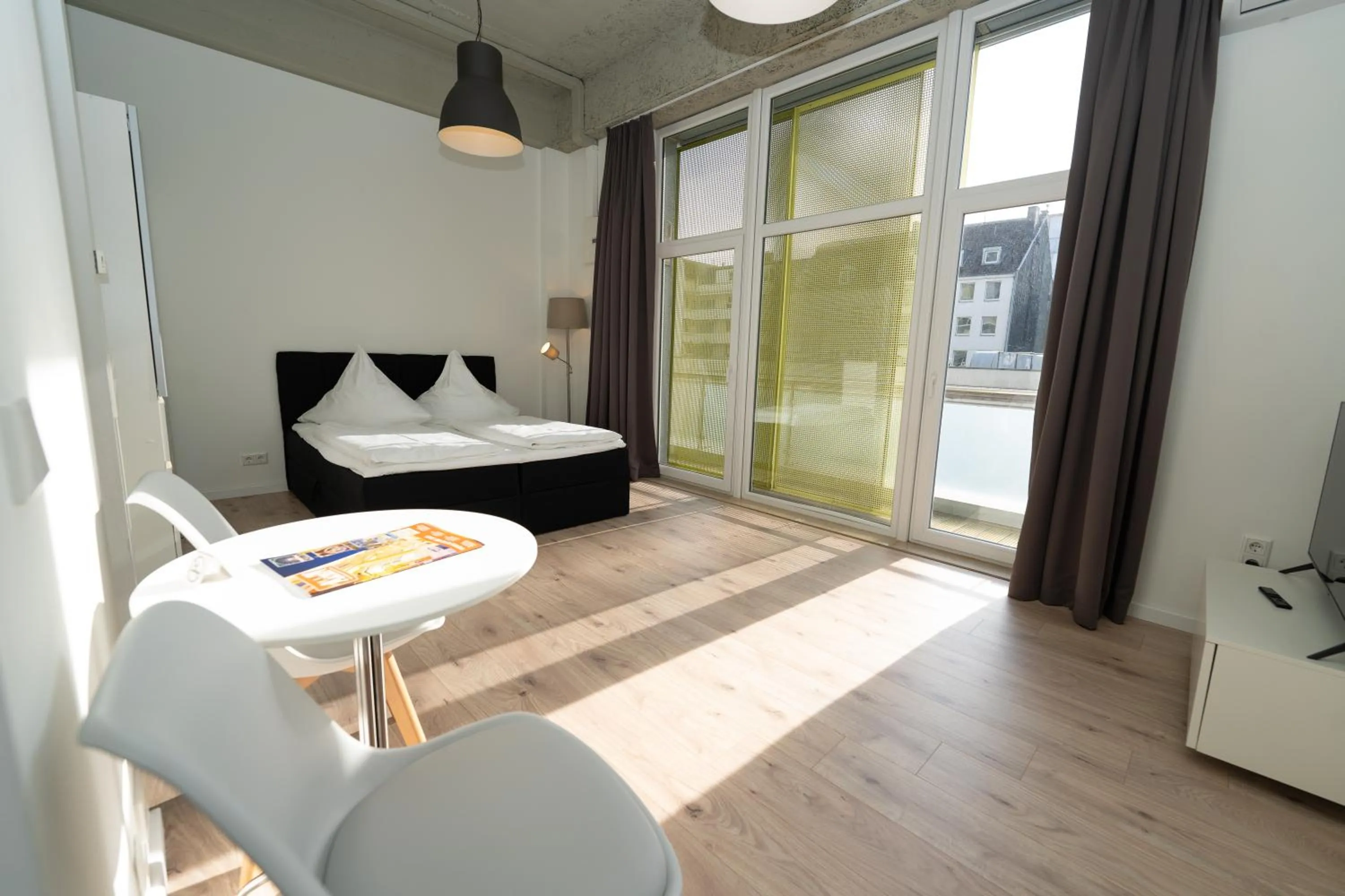 Living room, Bed in Das Loft Apartments