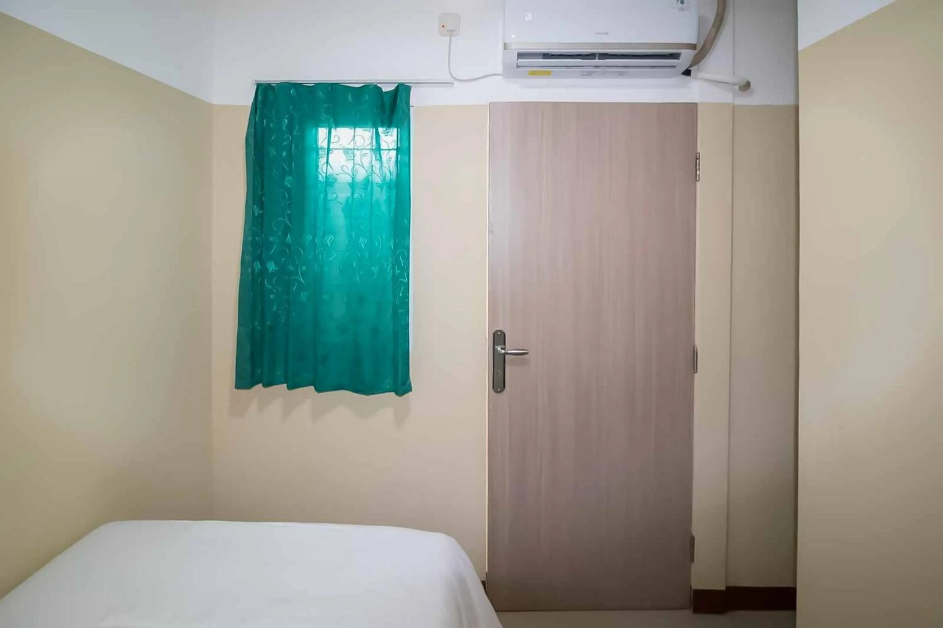 Bed in Miana Ancol Residence Mitra RedDoorz