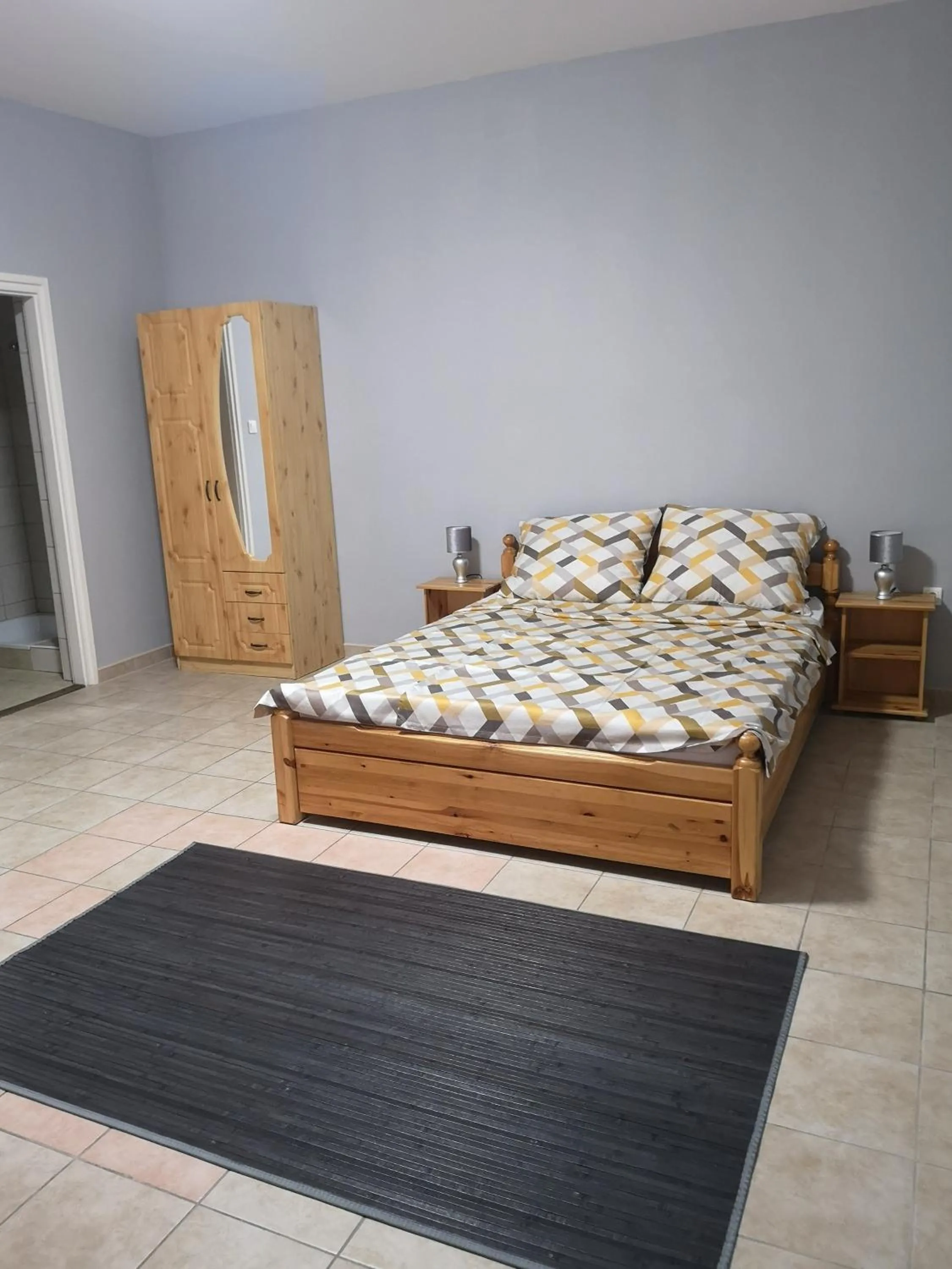 Bed in Amina Apartman