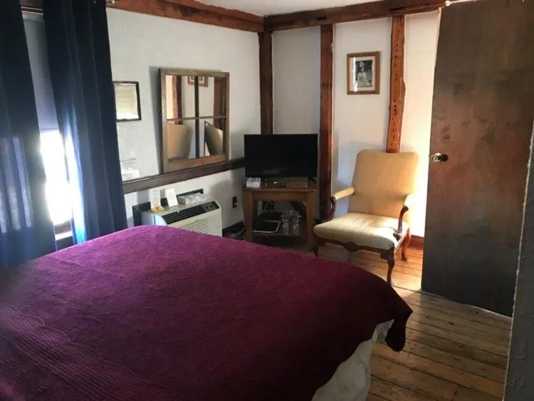 Bed in The Olde Angel Inn