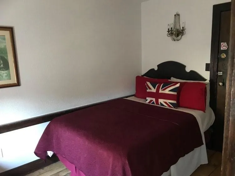 Bed in The Olde Angel Inn