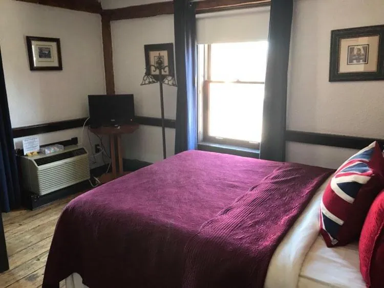 Bed in The Olde Angel Inn