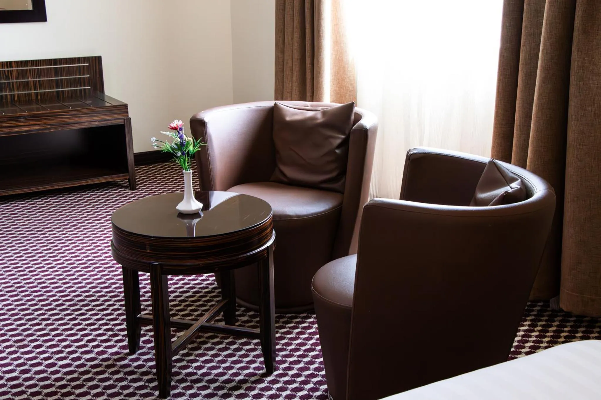 Seating area in Fortune Karama Hotel