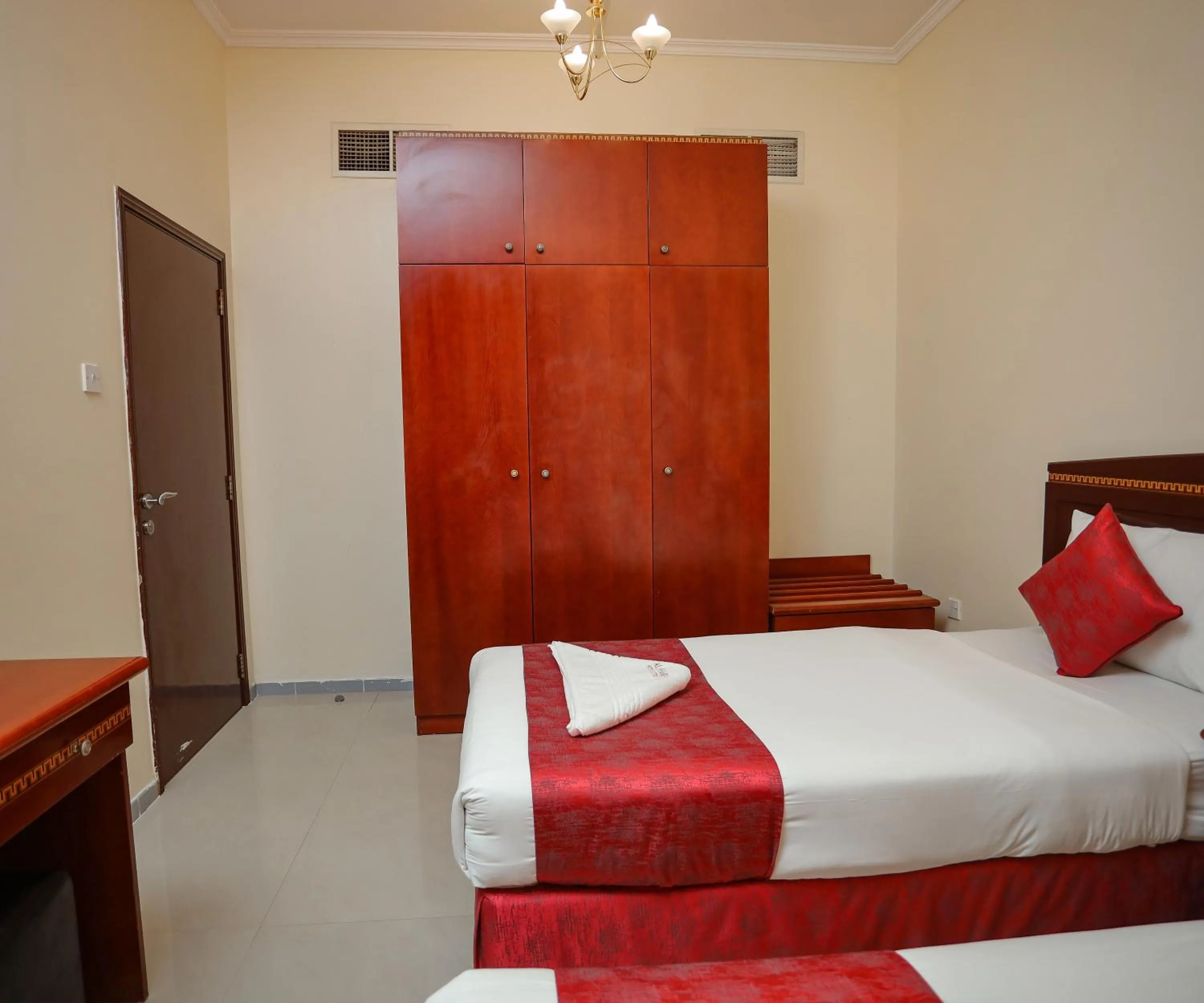 Bed in Al Sharq Hotels Suites