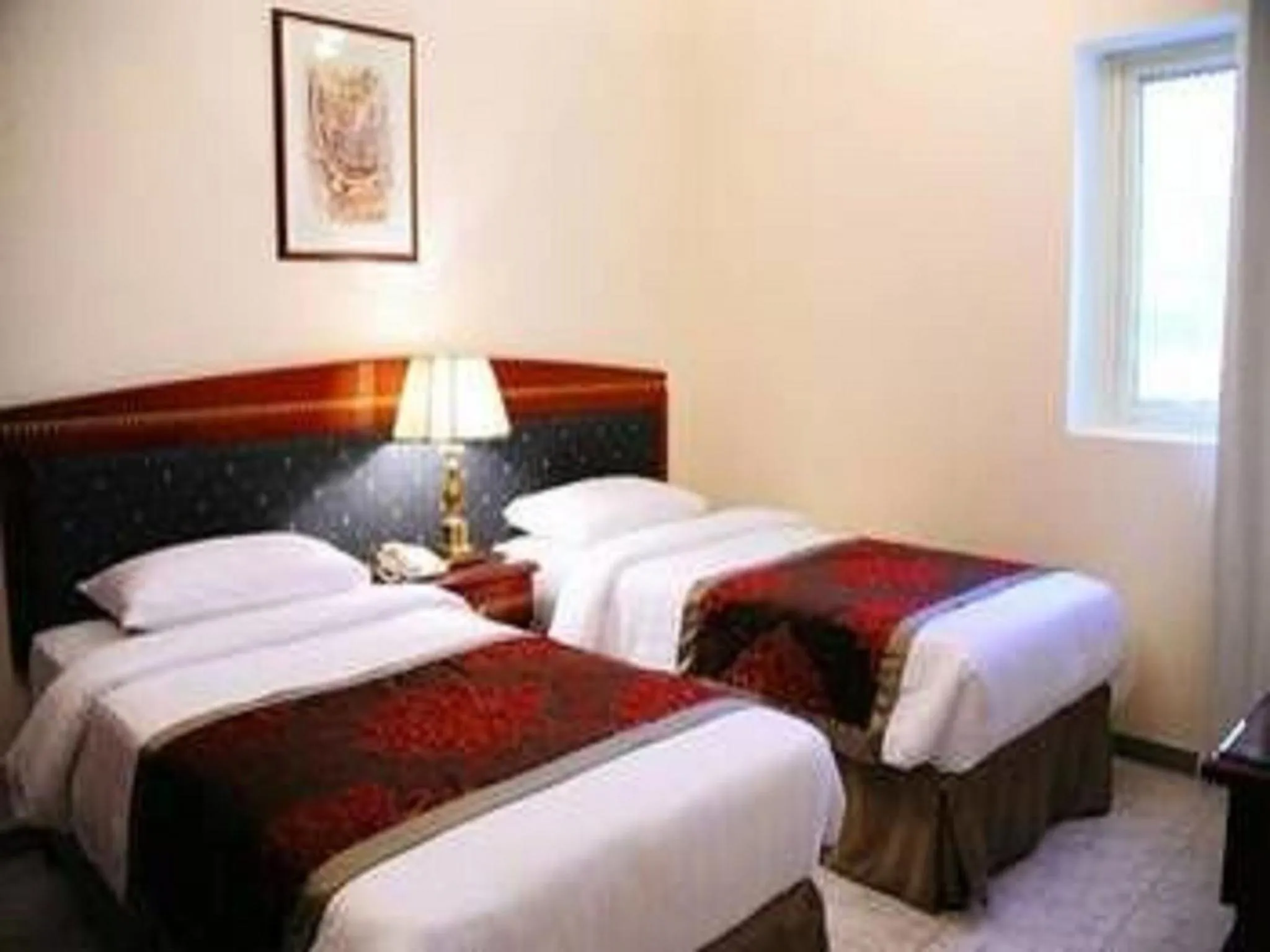 Bed in Al Sharq Hotels Suites