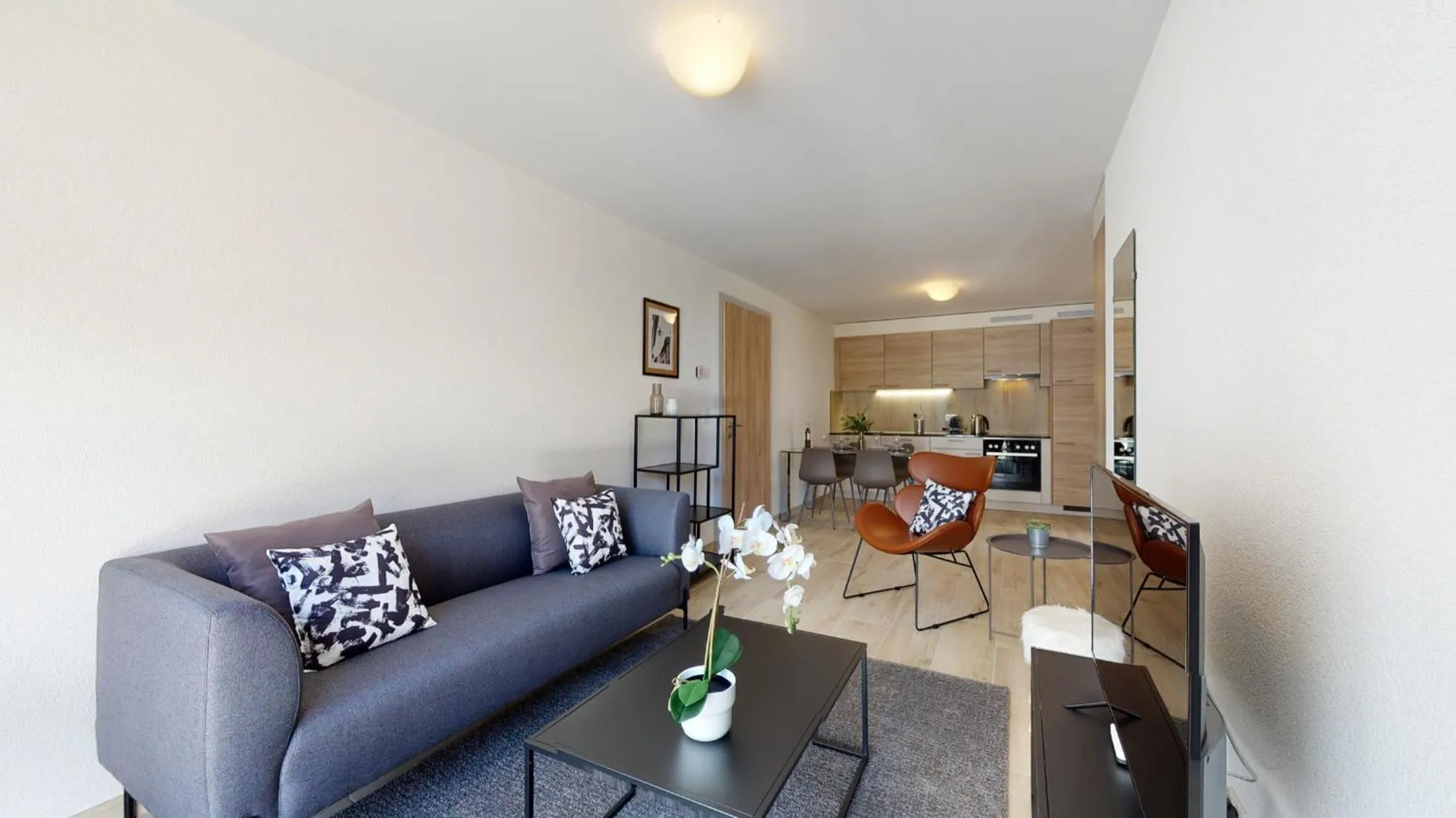 Living room in Nonanteneuf appart hōtel Aigle - contactless check-in