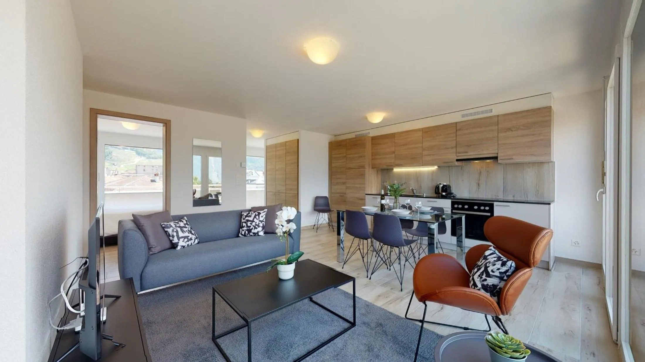 Kitchen or kitchenette in Nonanteneuf appart hōtel Aigle - contactless check-in