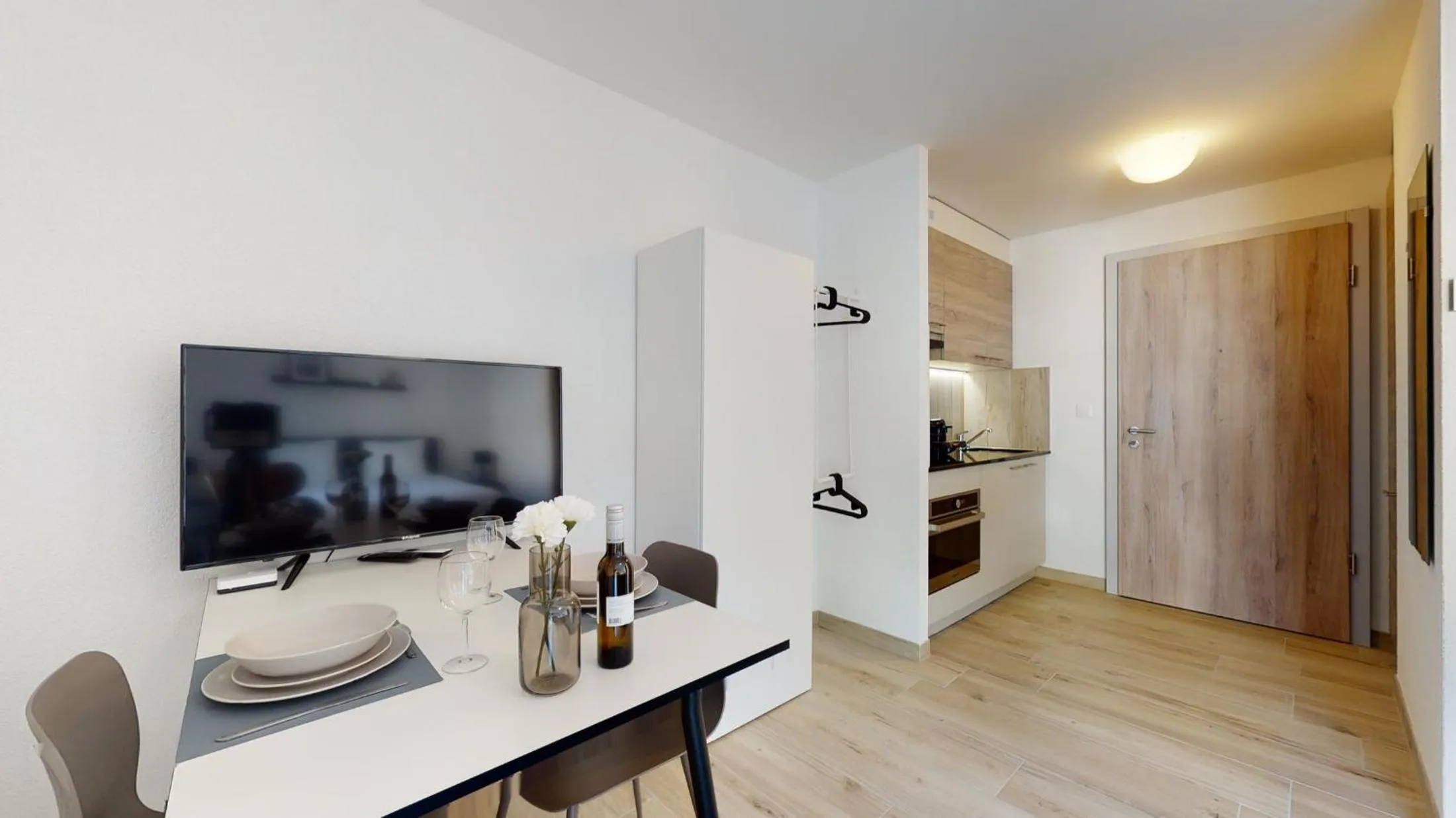 Kitchen or kitchenette in Nonanteneuf appart hōtel Aigle - contactless check-in