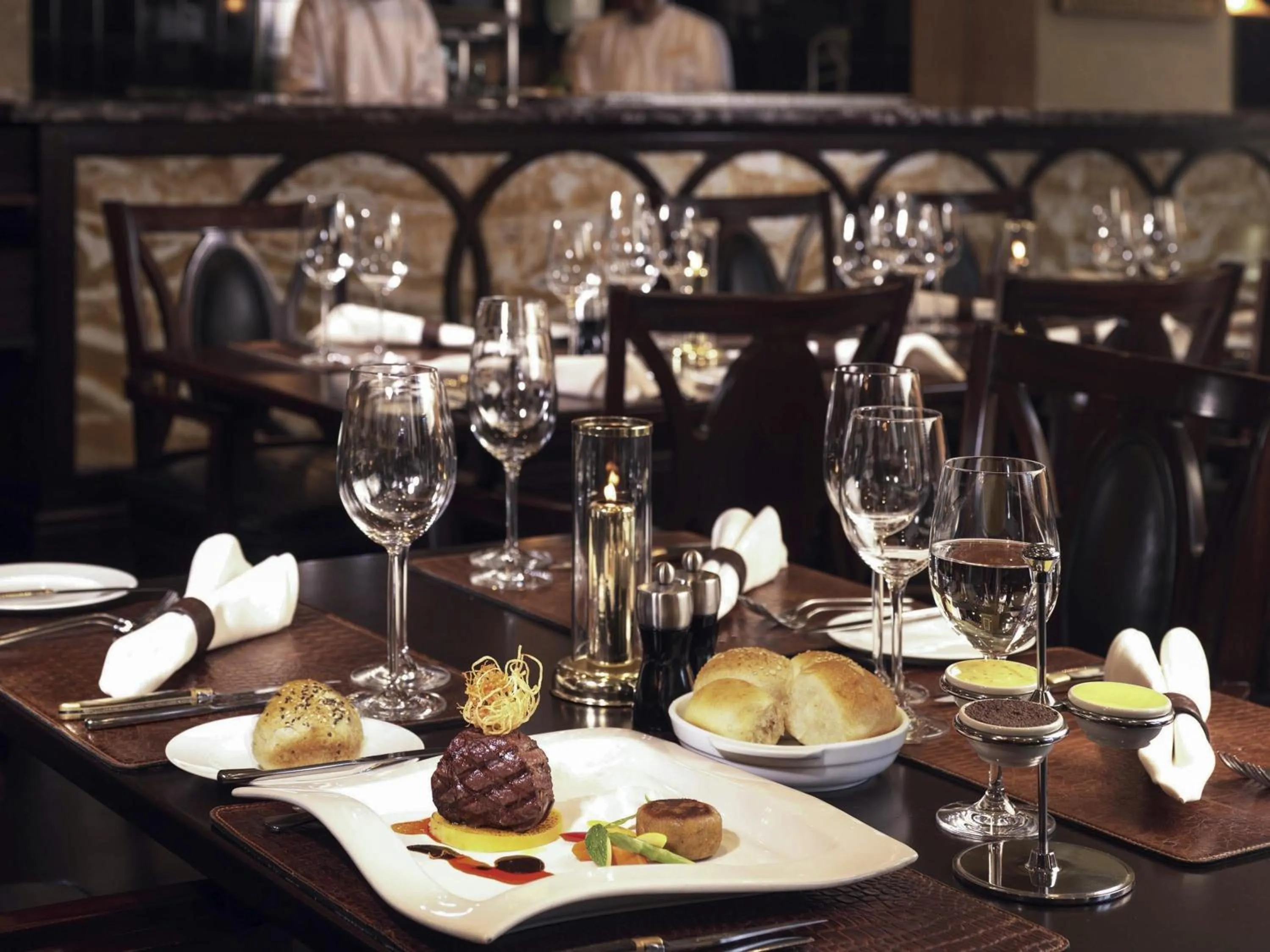 Lounge or bar in Mövenpick Grand Al Bustan