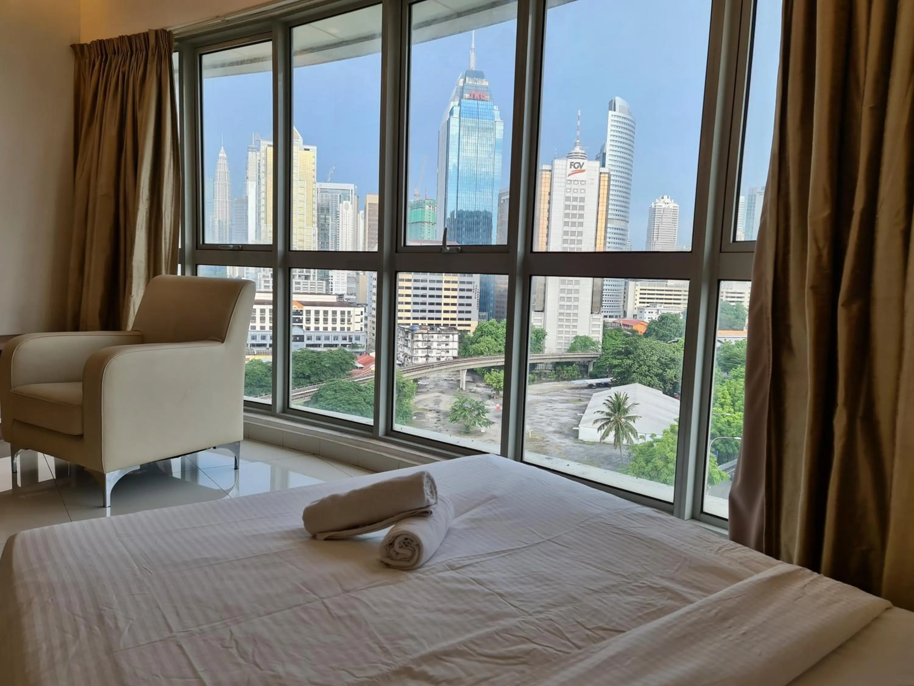 Bed in Regalia Residence KLCC View by iLuxHome