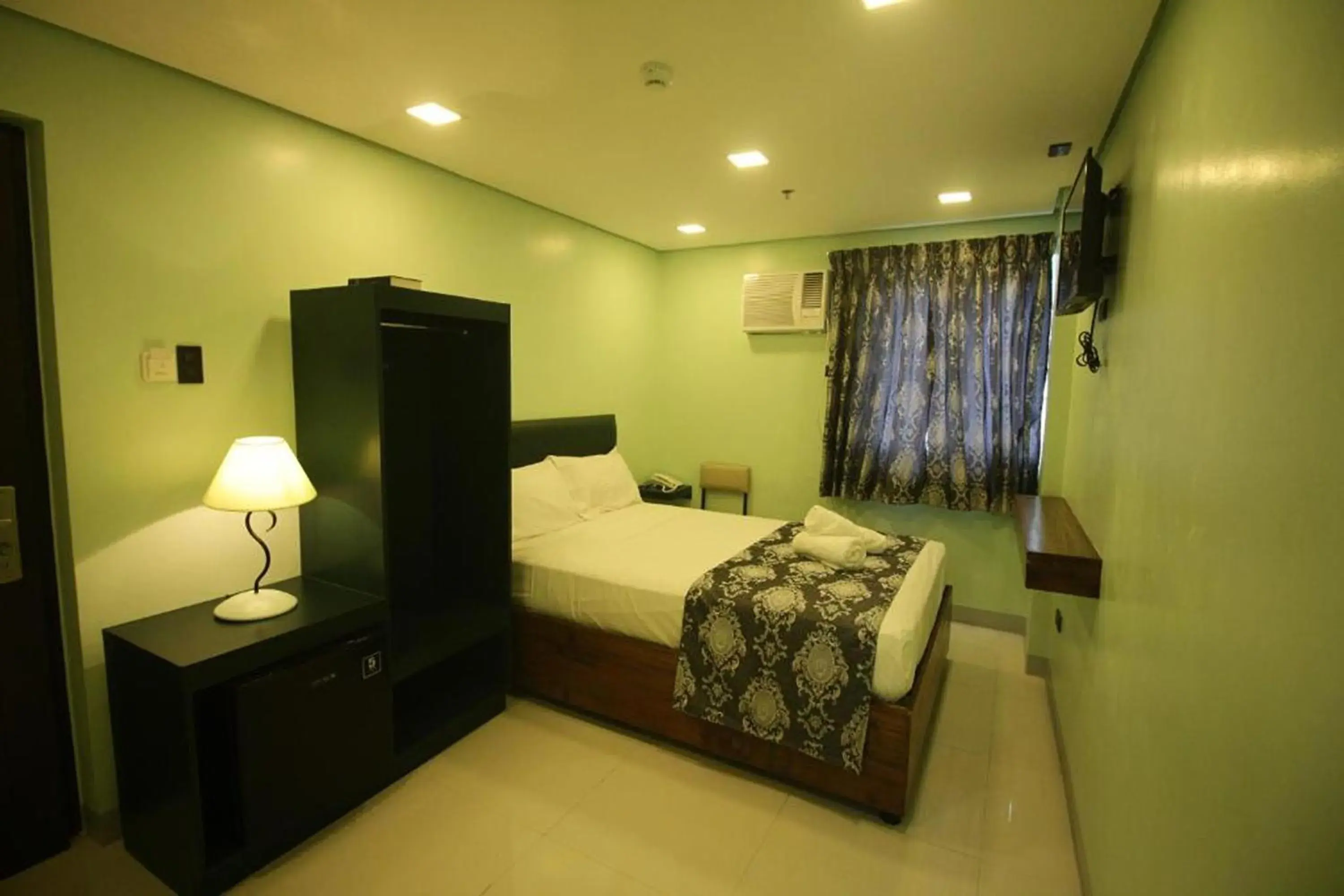 Photo of the whole room, Bed in Belltower CSheLi Suites Bantay - Vigan Photo of the whole room, Bed in Belltower CSheLi Suites Bantay - Vigan