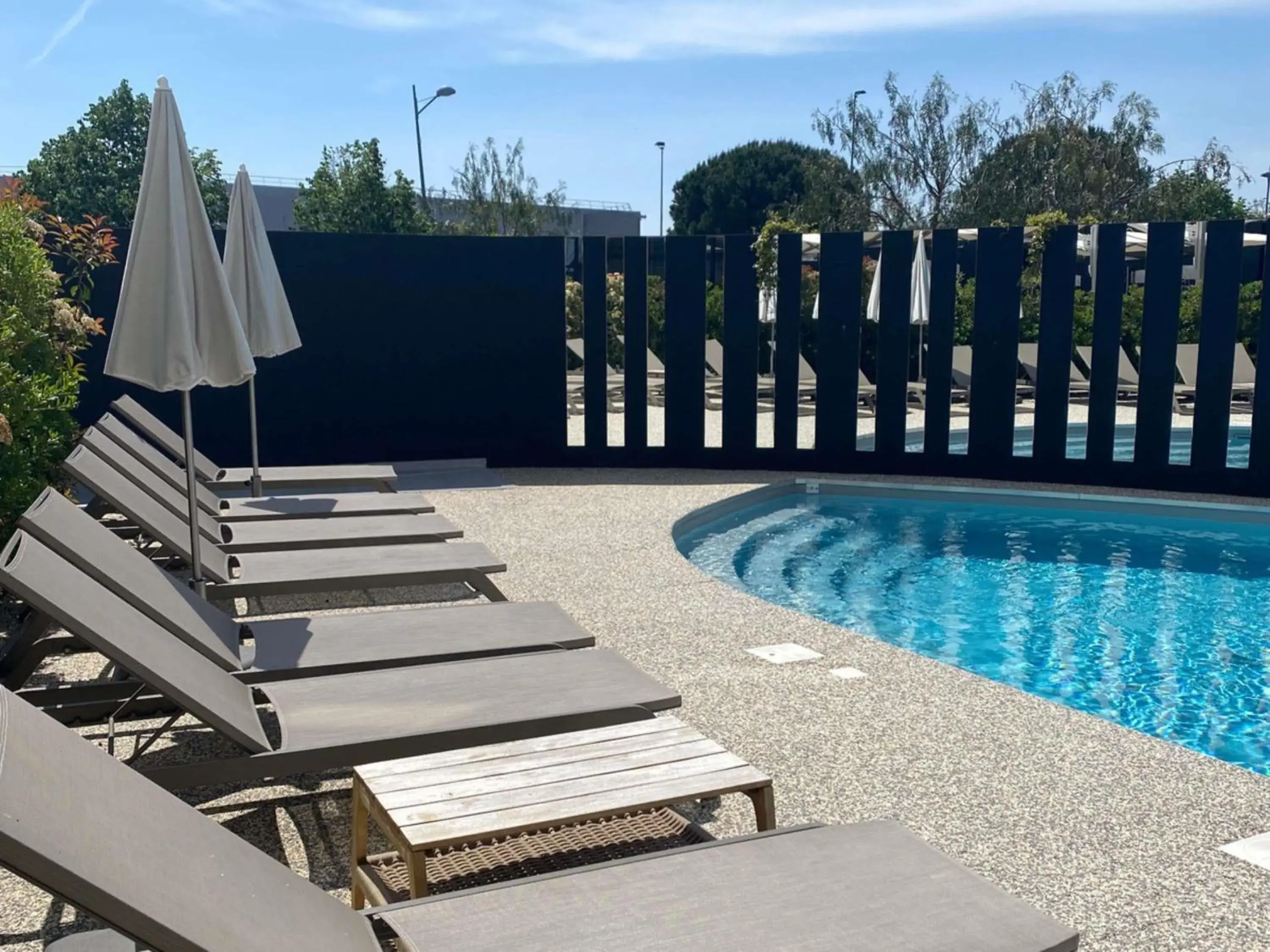 Pool view in Ibis Lunel Petite Camargue Pool view in Ibis Lunel Petite Camargue