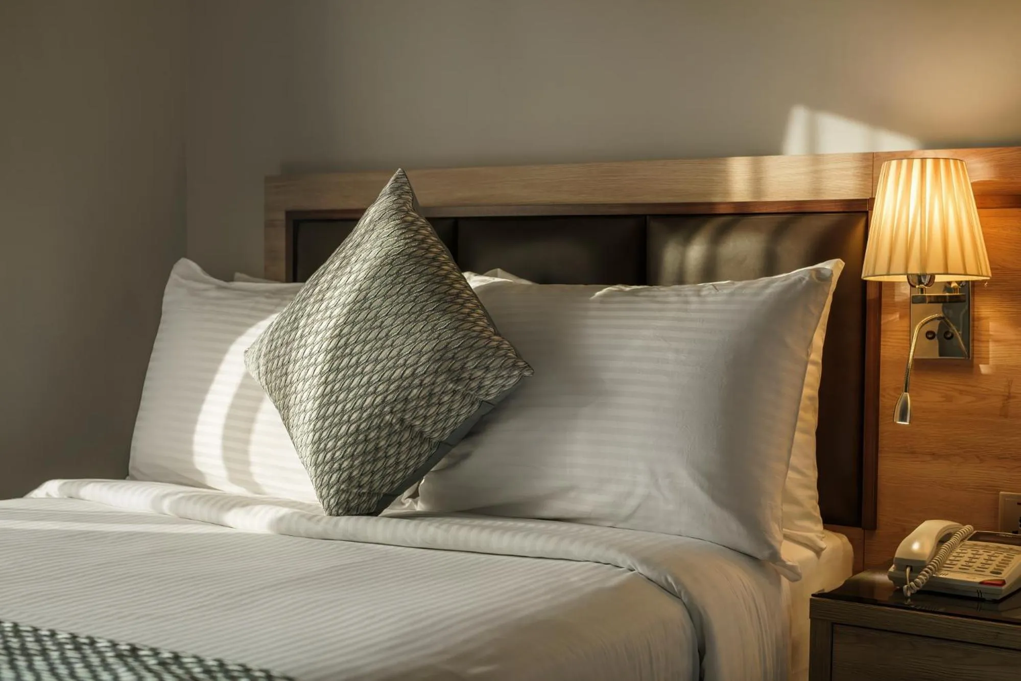 Bed in Hotel Holiday International