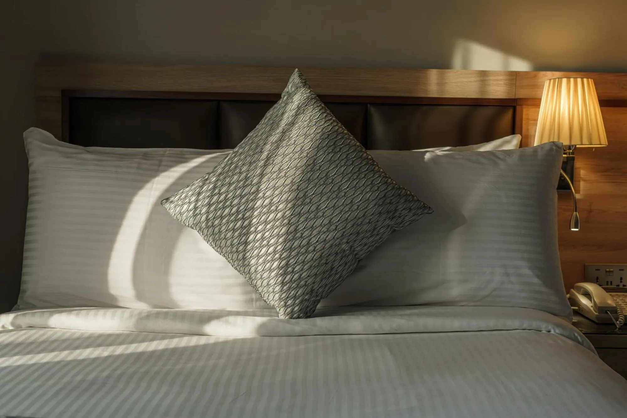 Bed in Hotel Holiday International