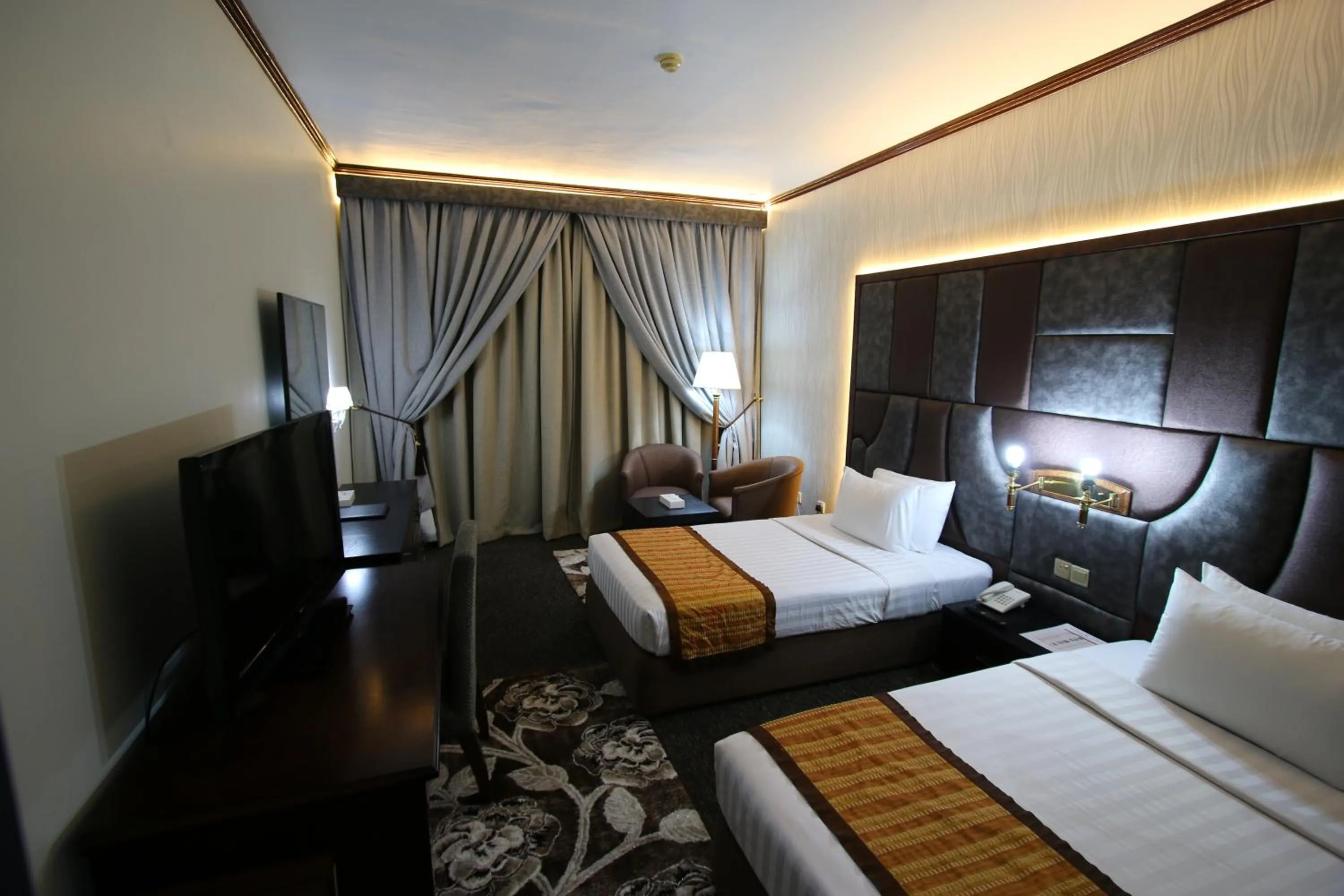 Bed in Grand Mayfair Hotel