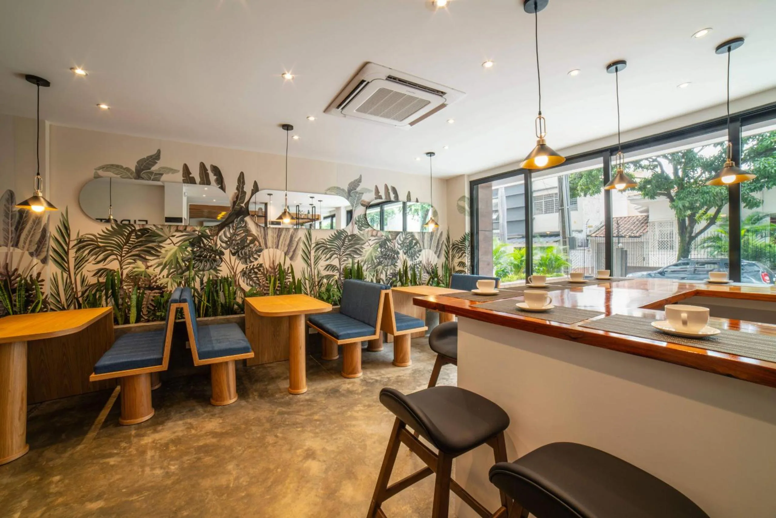 Dining area in Cali River Suites by Yellowkey Capital