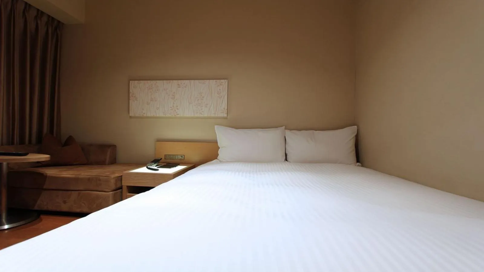 Bed in KOKO HOTEL Fukuoka Tenjin