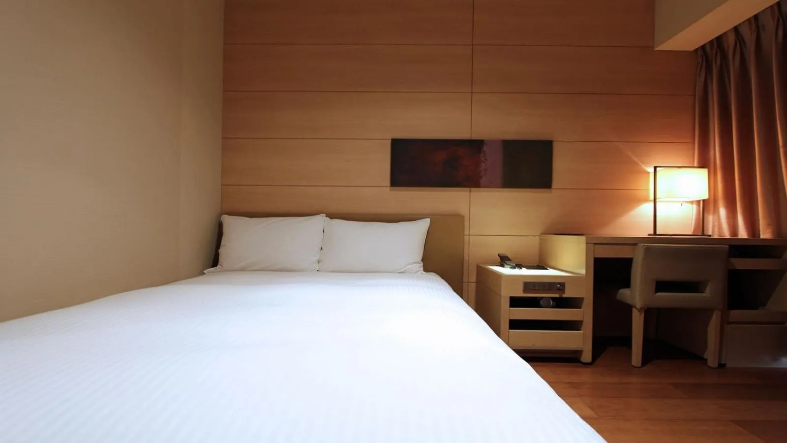 Bed in KOKO HOTEL Fukuoka Tenjin