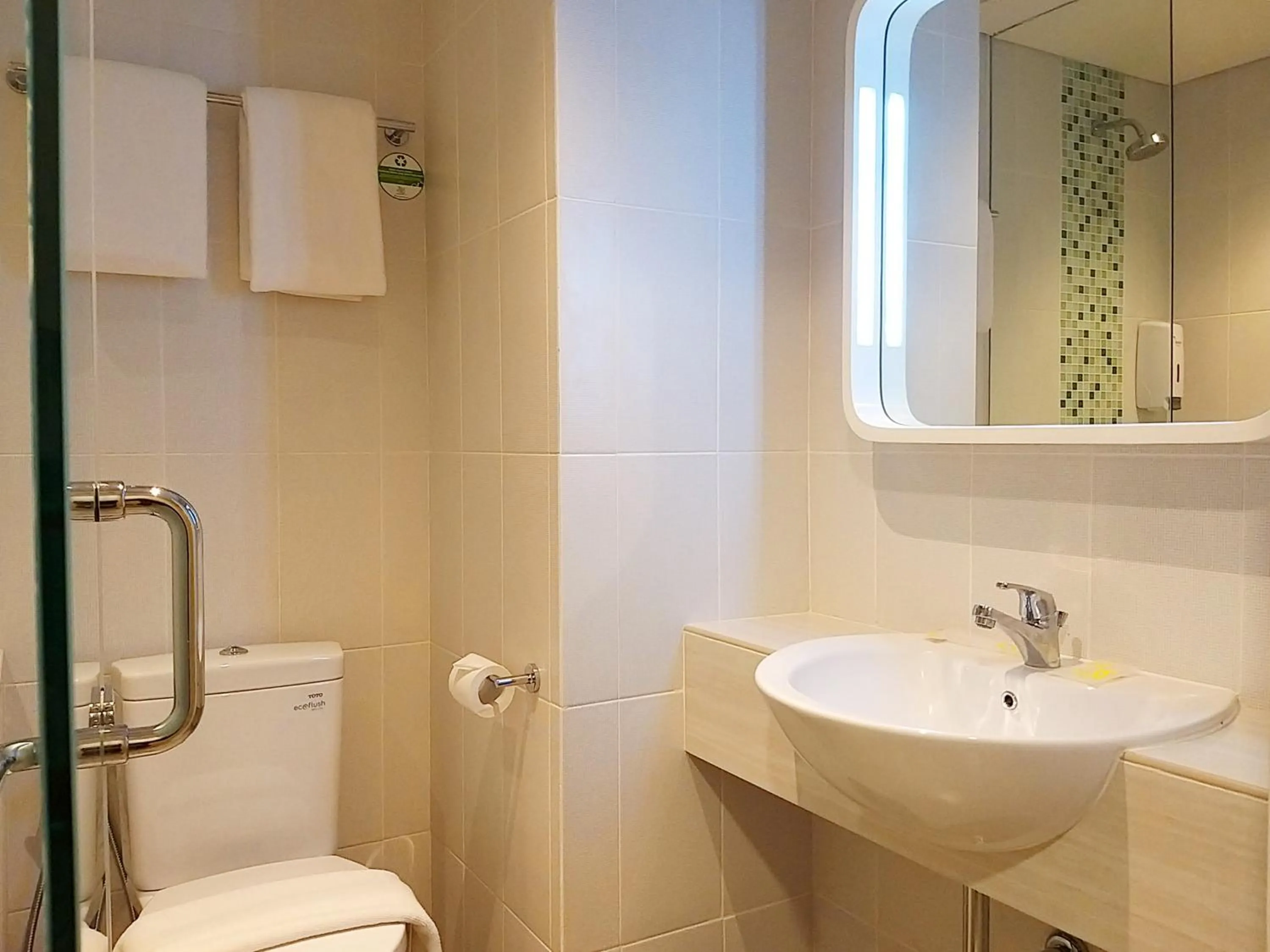 Bathroom in Zest Parang Raja Solo by Swiss-Belhotel International