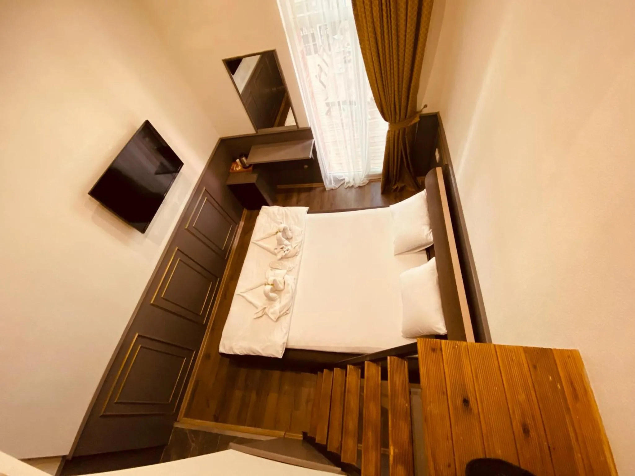 Communal lounge/ TV room, Bed in GANJ Hotel