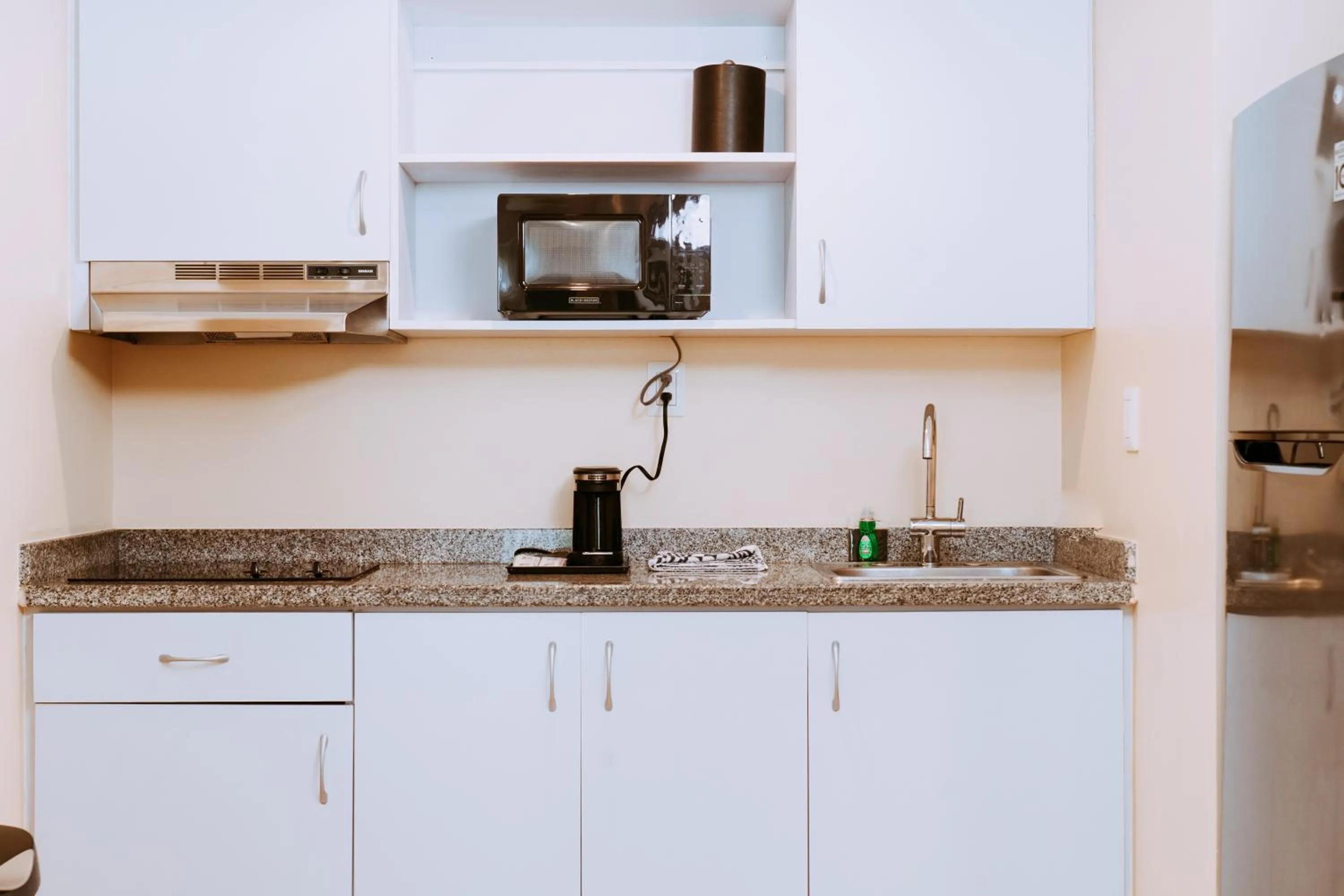 Kitchen or kitchenette in The Mill Resort and Suites