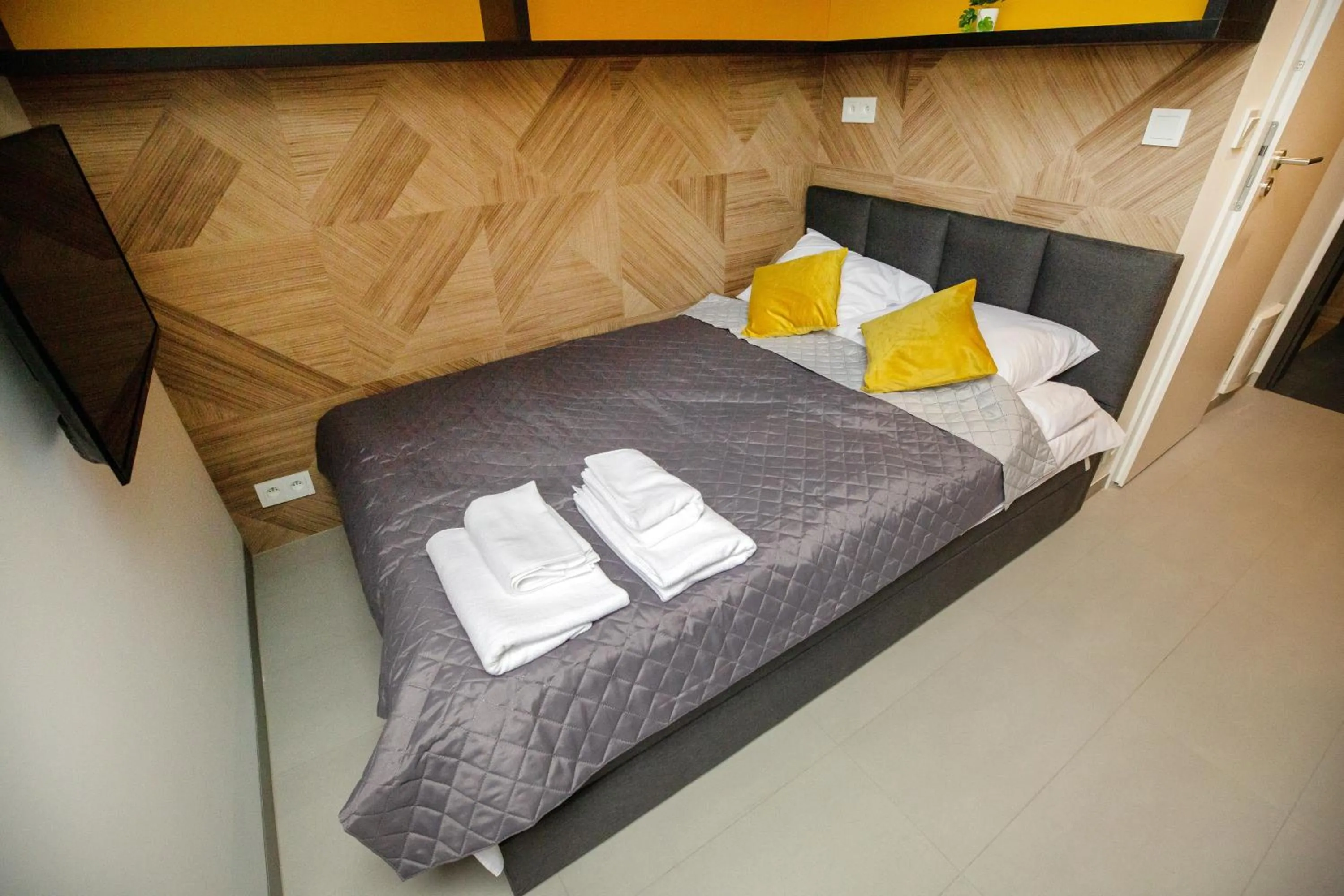 Photo of the whole room, Bed in iroom