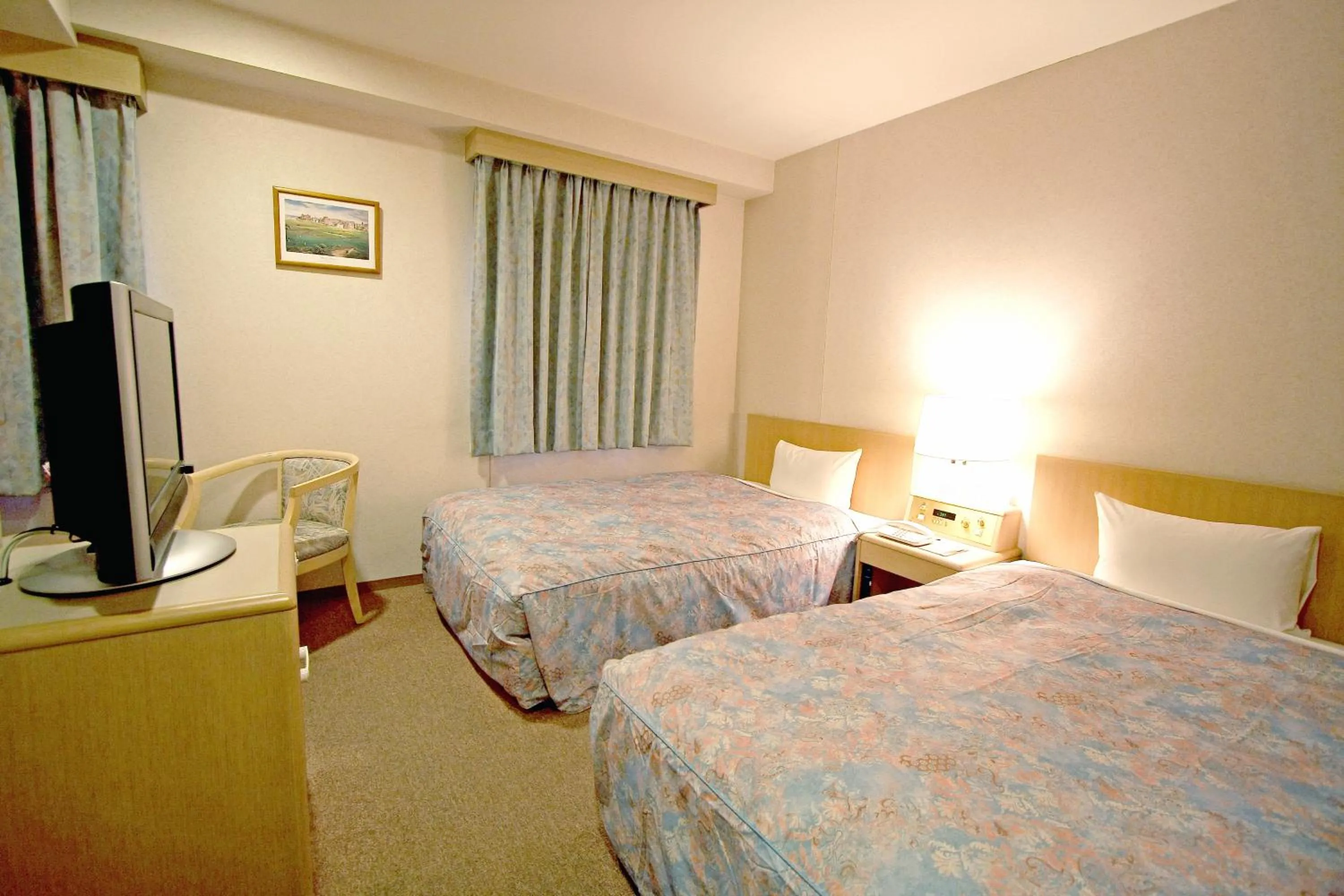 Bed in Hotel Central Sendai