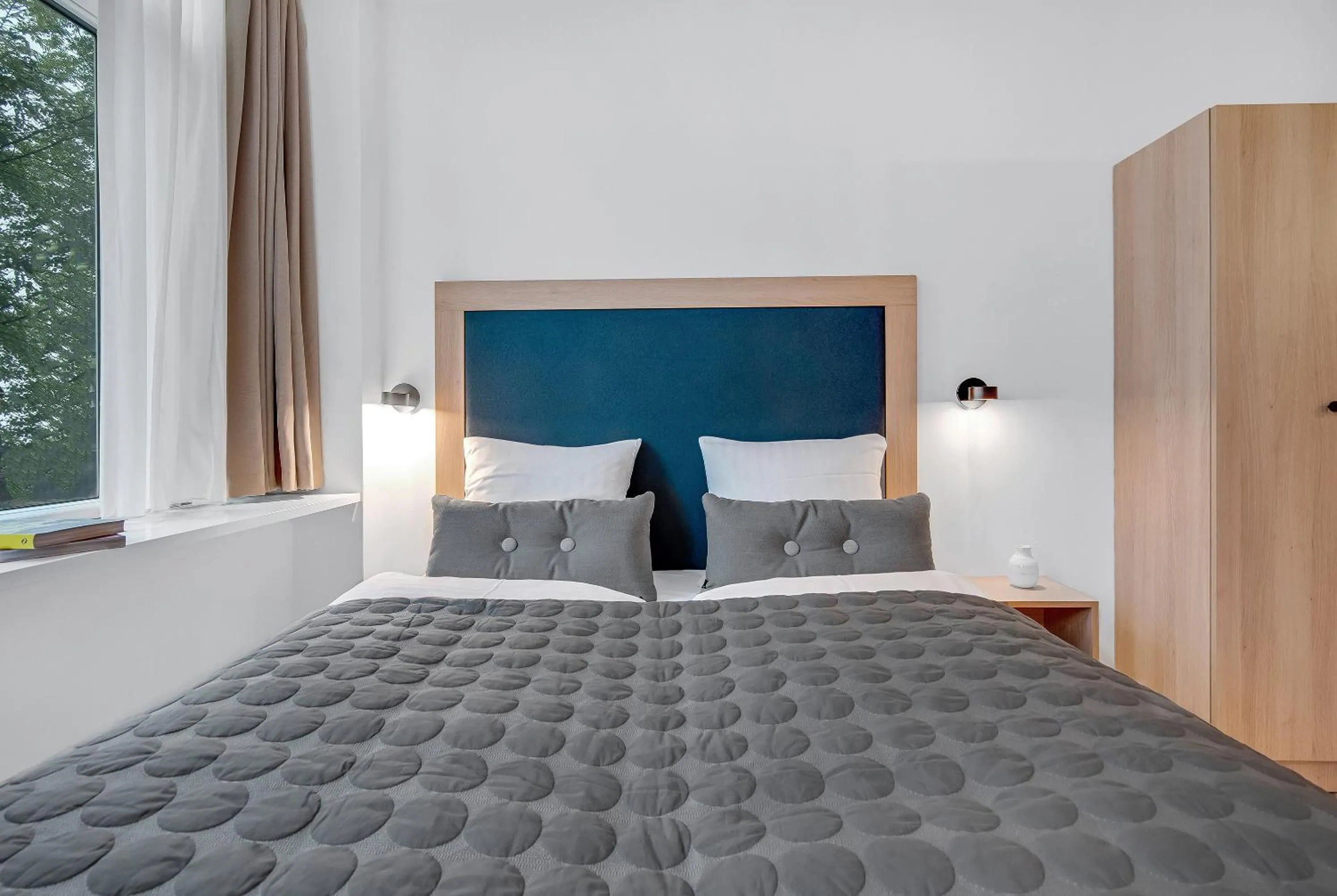 Bed in STUDIO1A Hotel Apartments