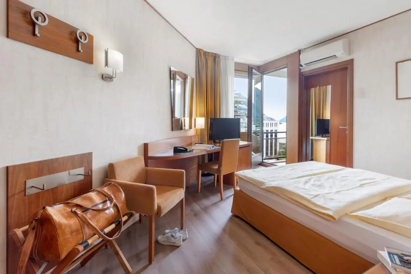 Bed in Hotel Delfino Lugano Bed in Hotel Delfino Lugano