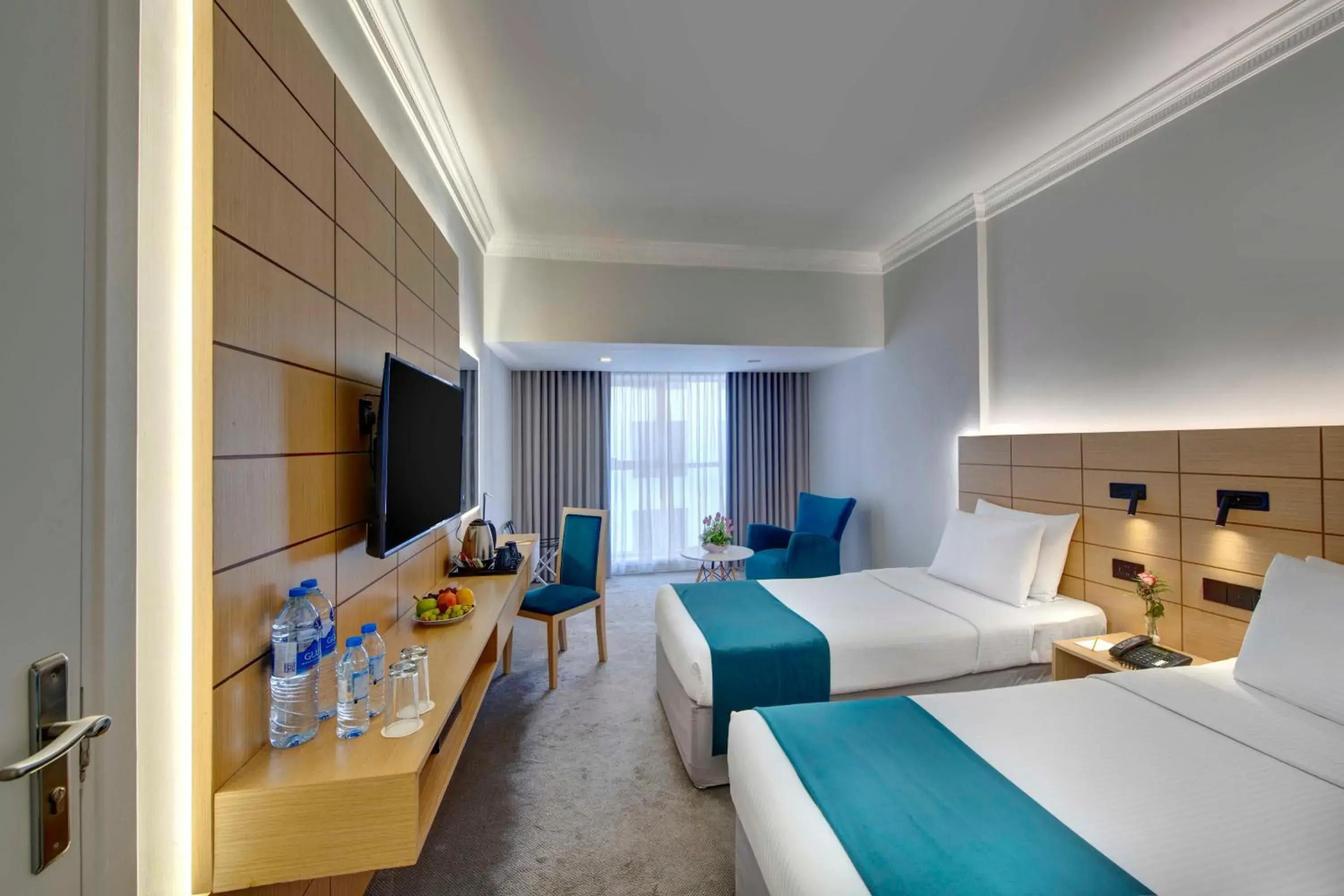 Communal lounge/ TV room, Bed in Lotus Grand Hotel Communal lounge/ TV room, Bed in Lotus Grand Hotel