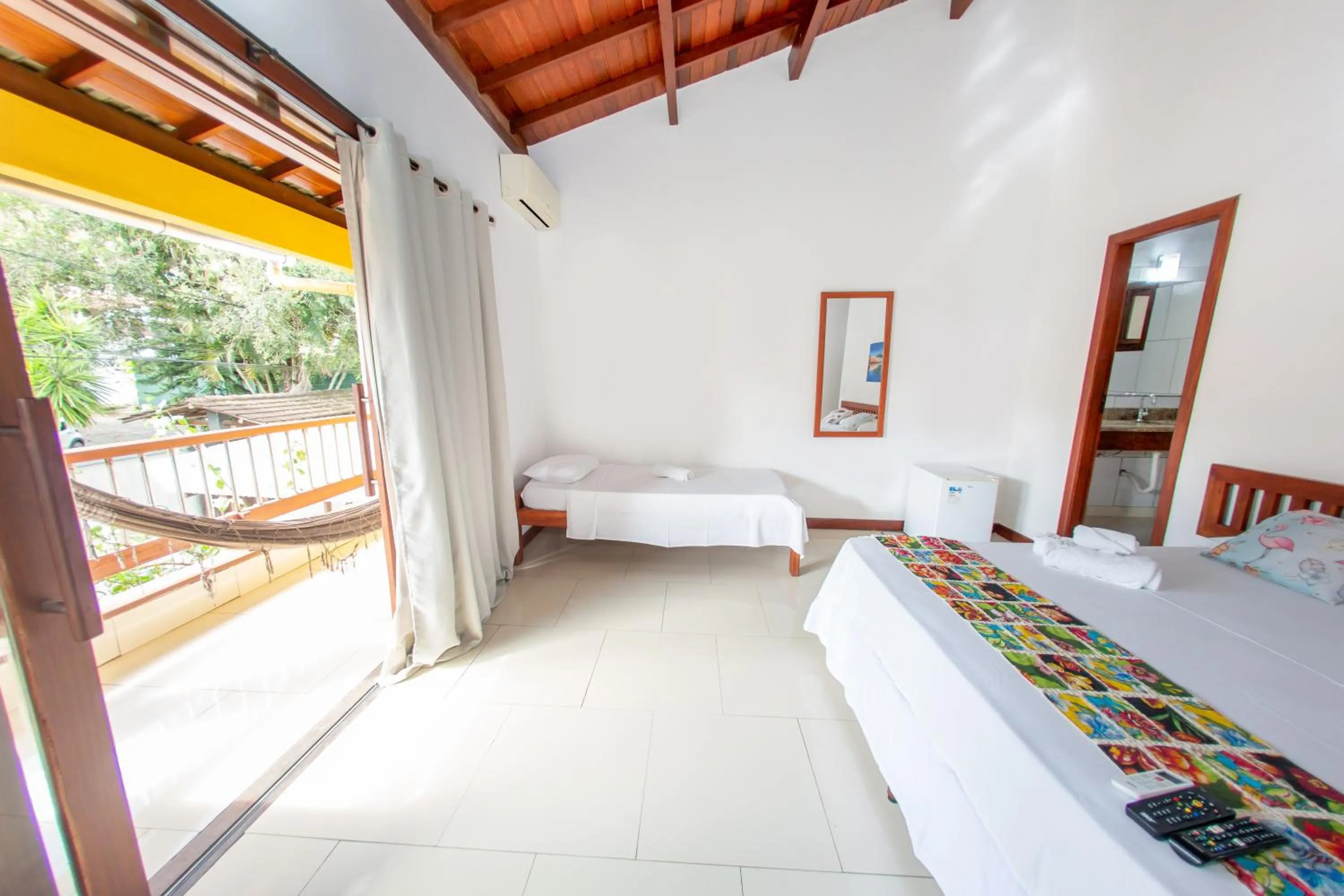 Bed in Pousada Flor do Arraial