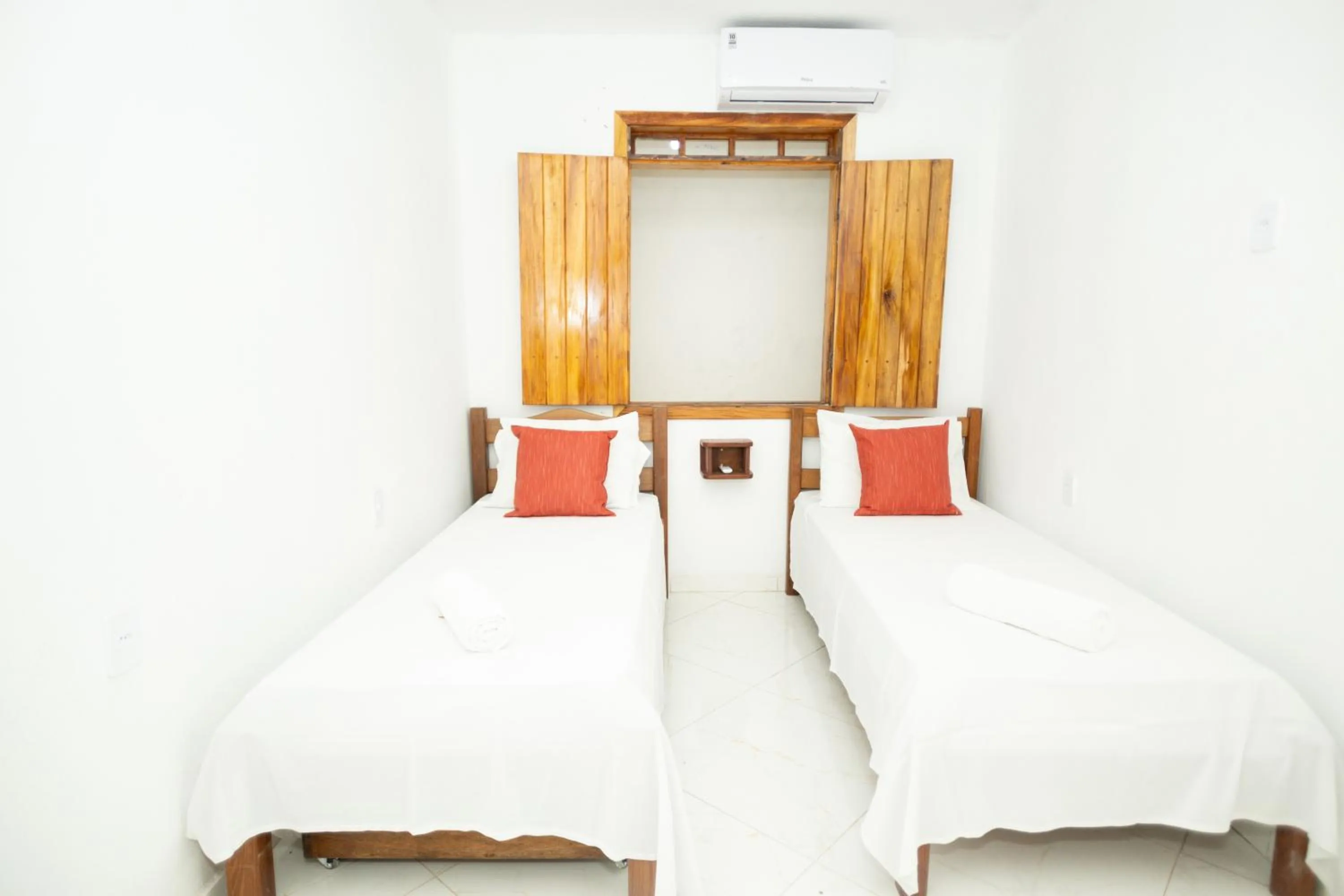 Bed in Pousada Flor do Arraial