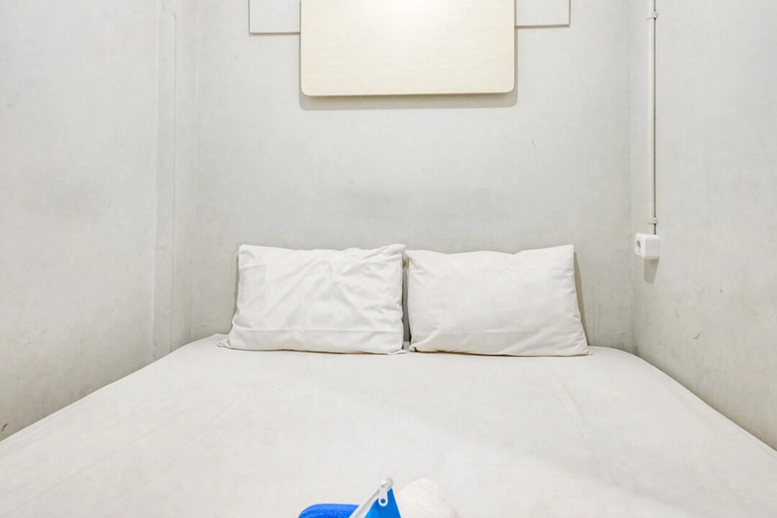 Bed in Marson Interkota Residence Mitra RedDoorz