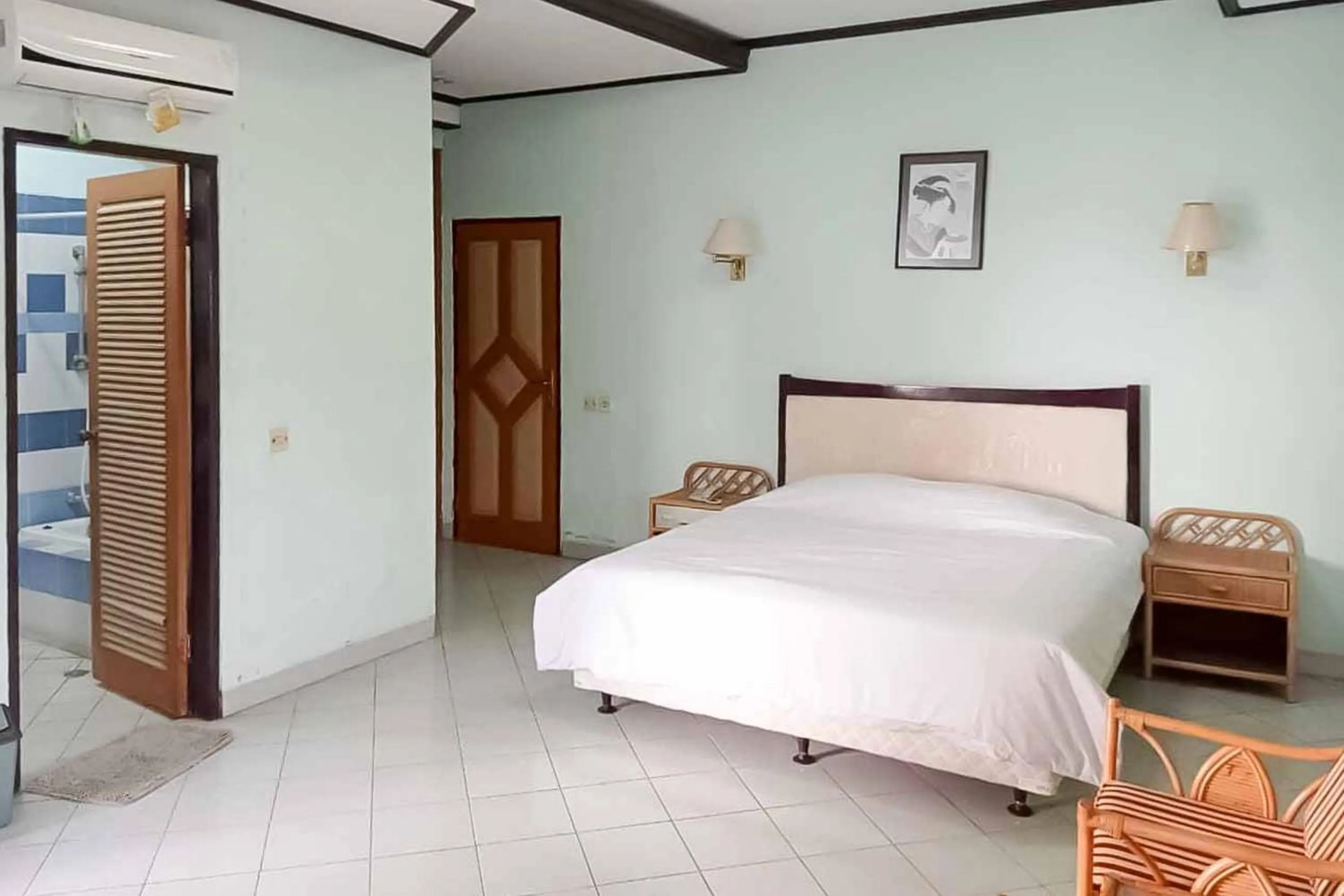 Bed in RedDoorz Plus near Tugu Mercusuar Anyer