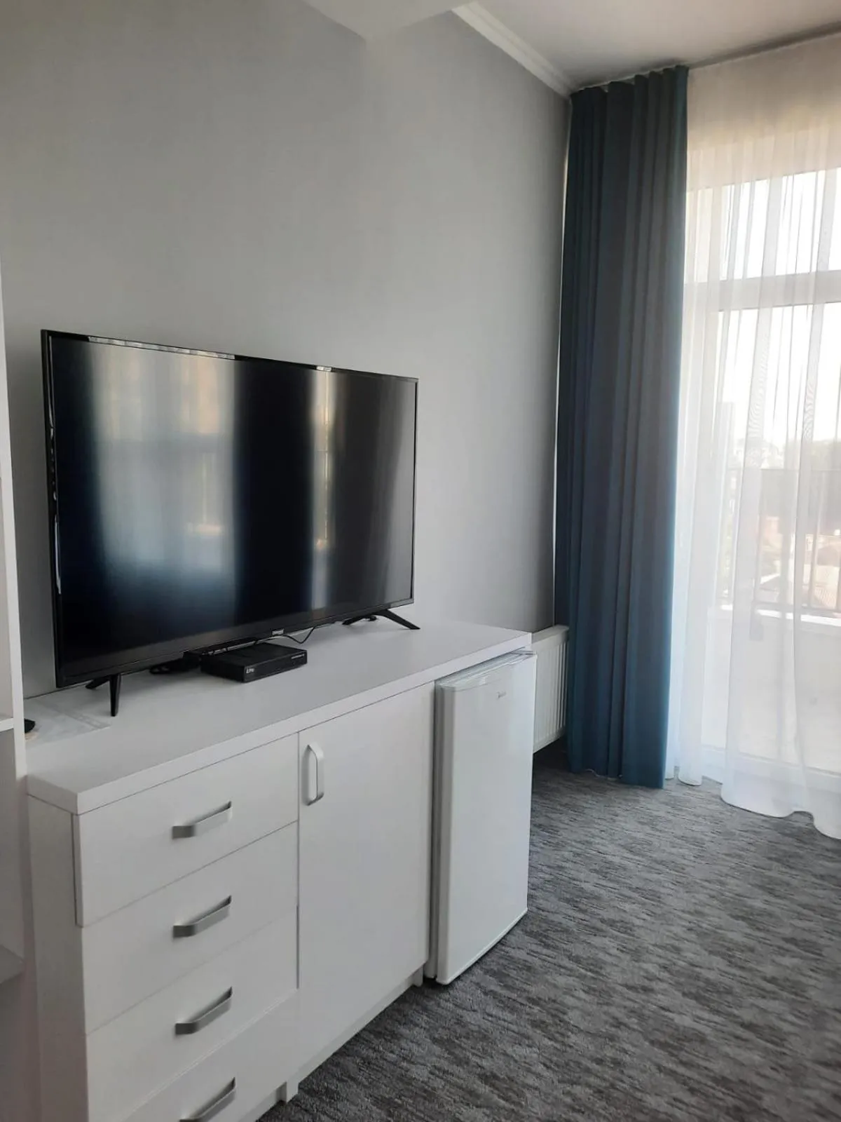 Communal lounge/ TV room in Glass Cube Hotel