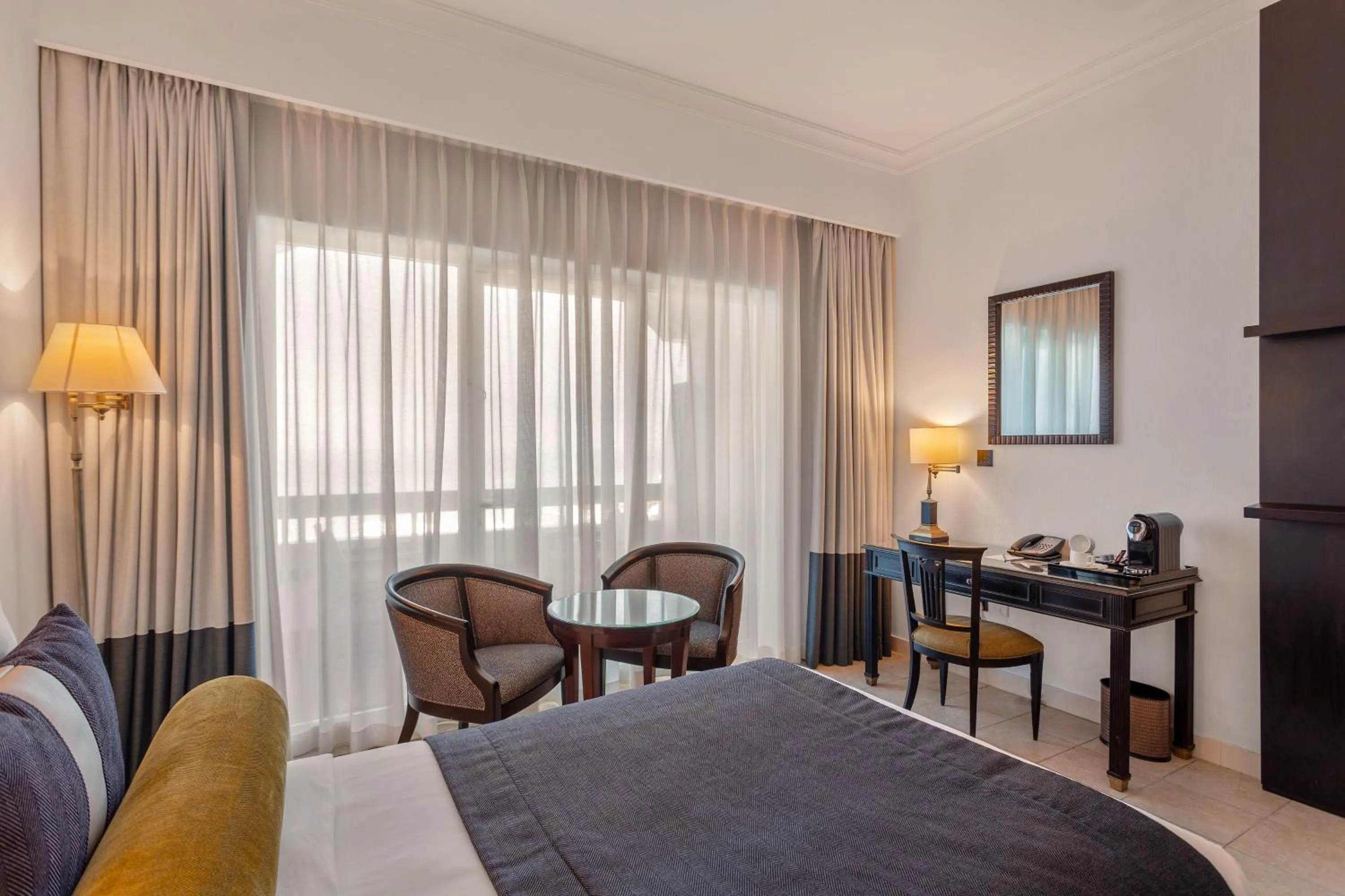 Bed in Ajman Hotel & Villas by Blazon Hotels