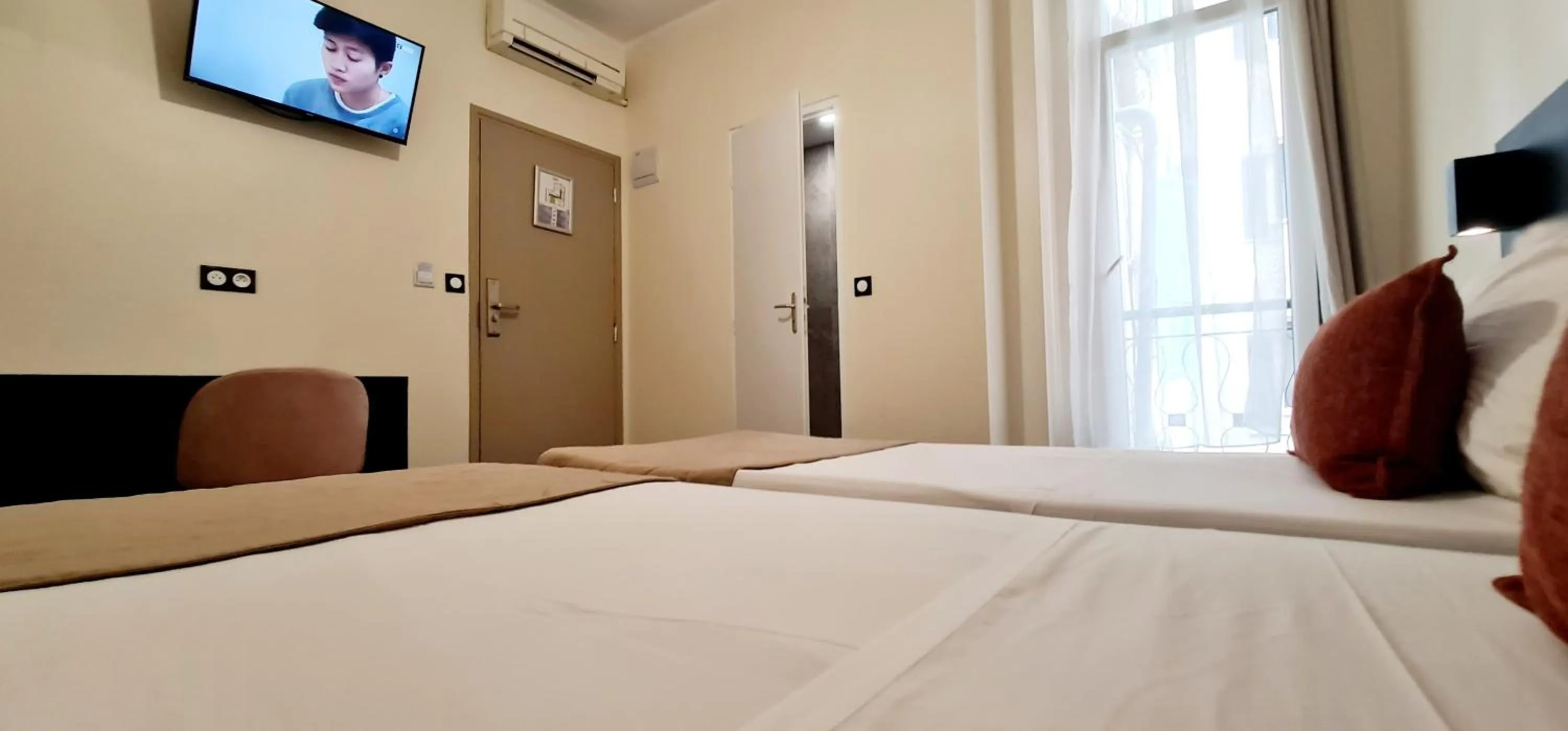Bed in Evelia Hotels