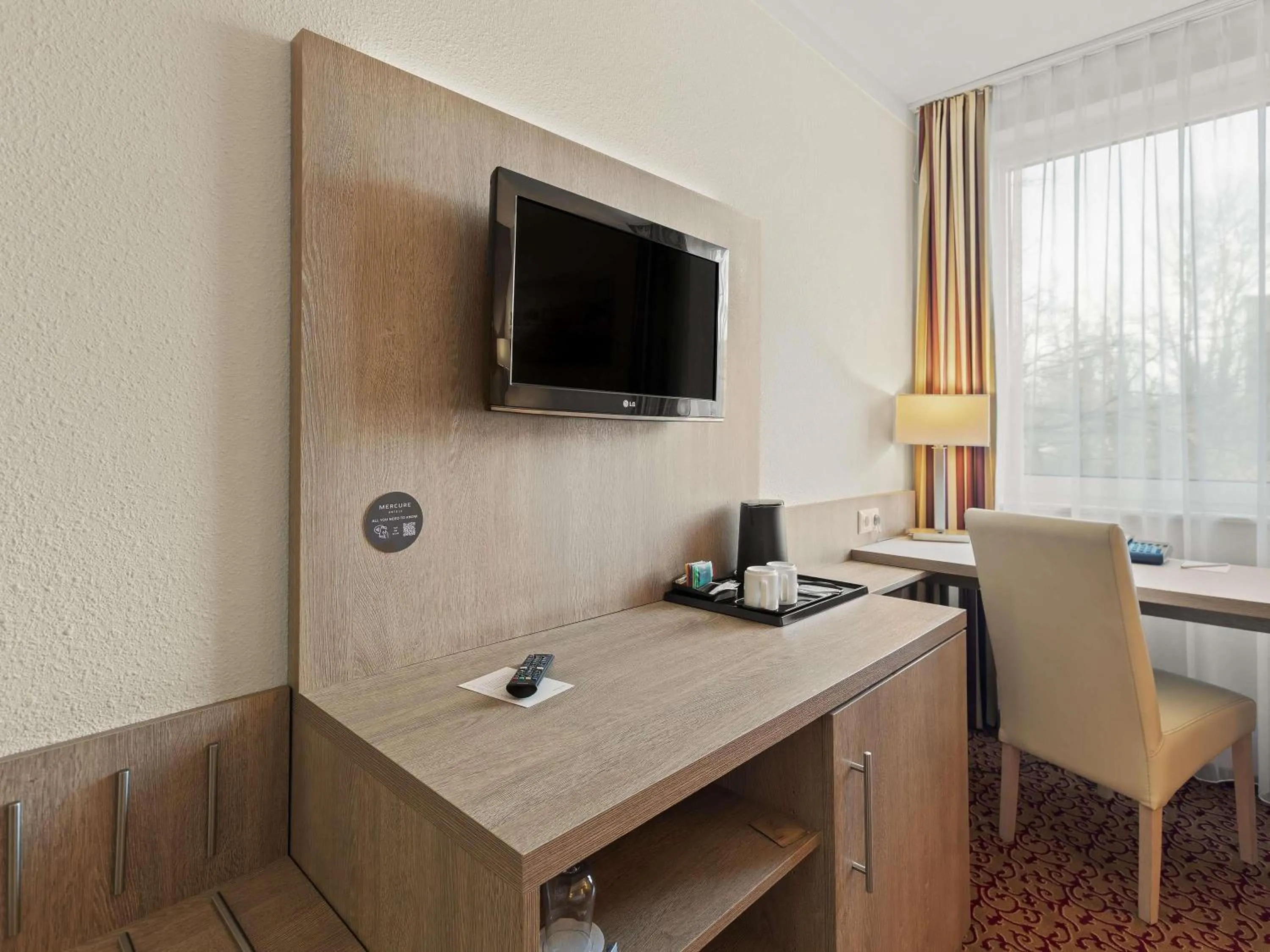 Bedroom in Mercure Hotel Hamburg am Volkspark