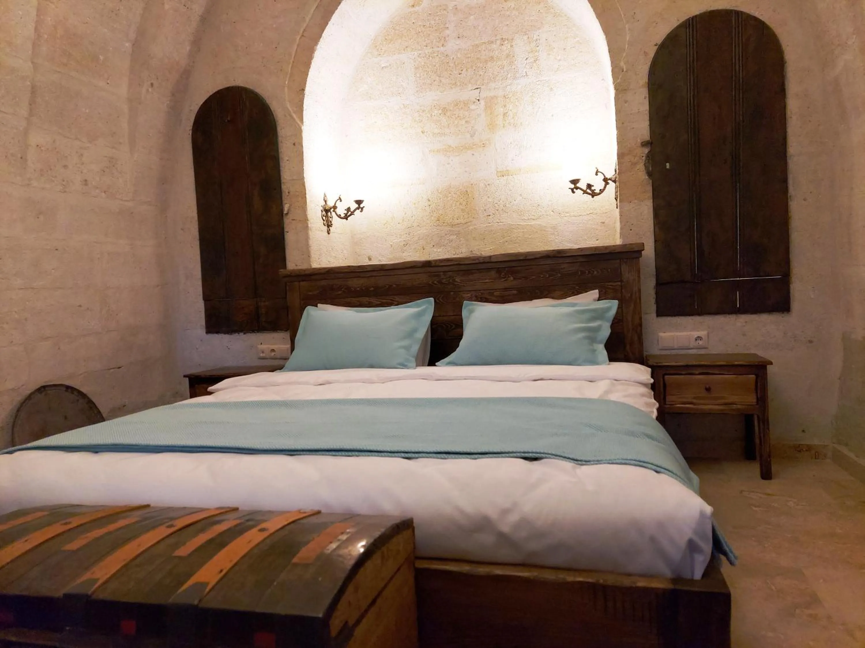 Bed in ARMEsos Cave Hotel