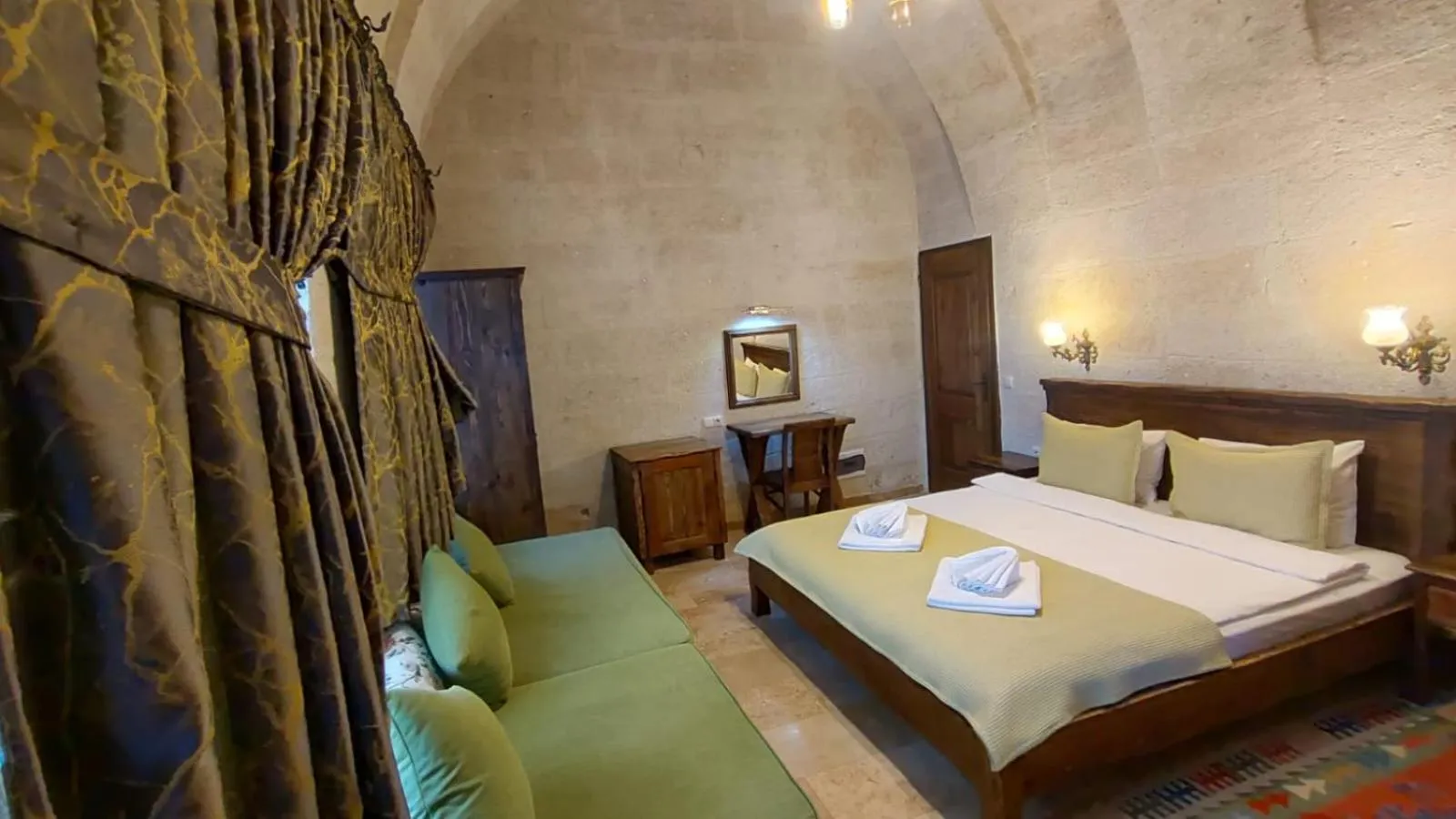 Bed in ARMEsos Cave Hotel