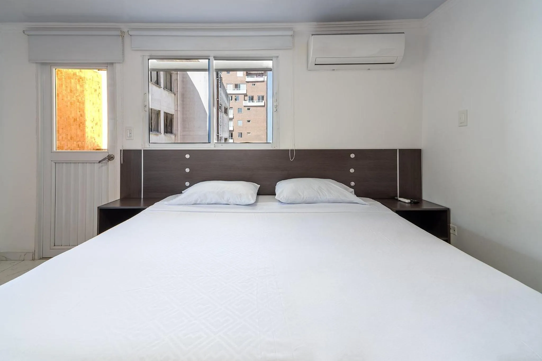 Bed in Villa Santos Apartaestudios