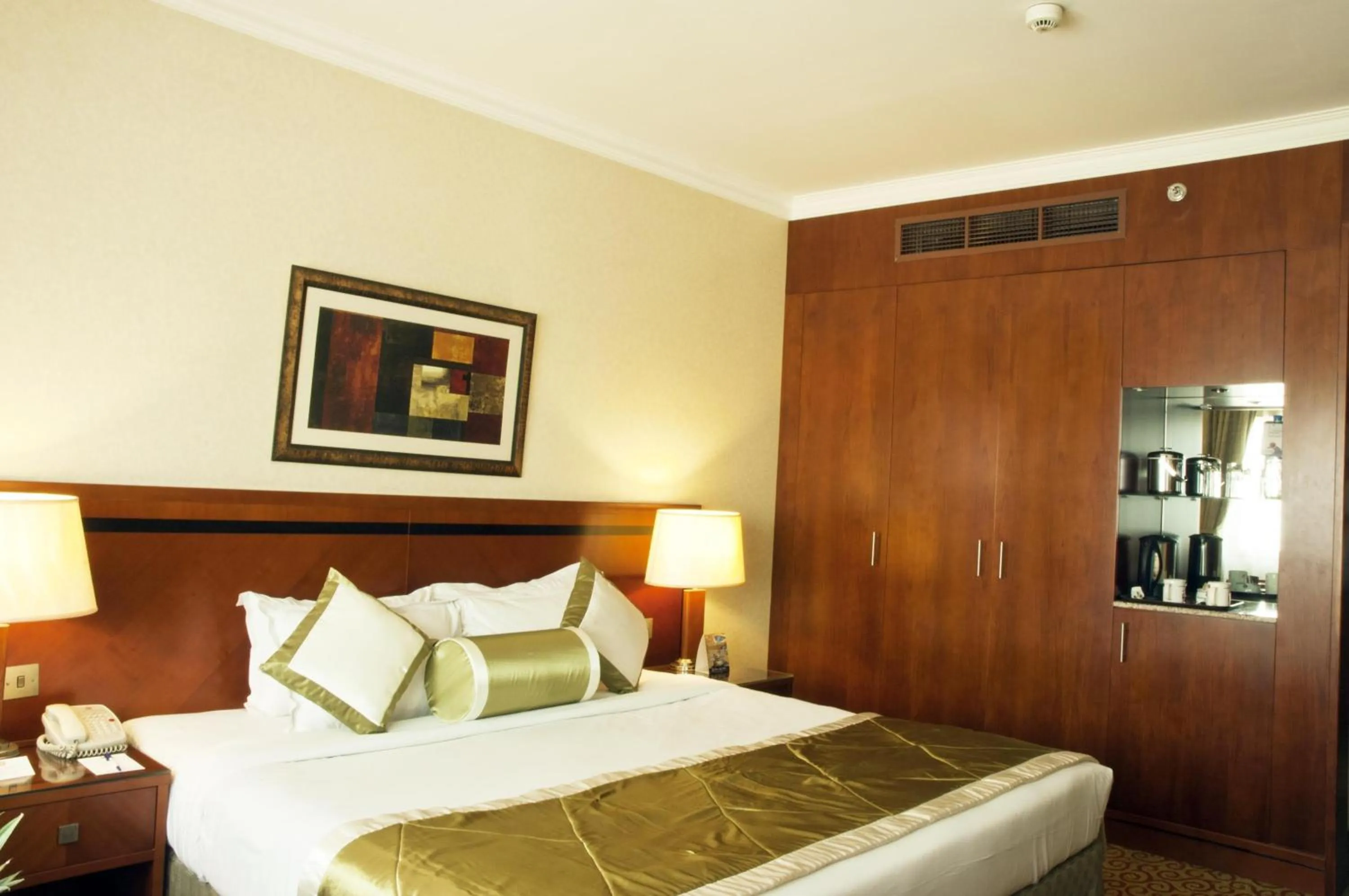 Bed in Ramee Royal Hotel