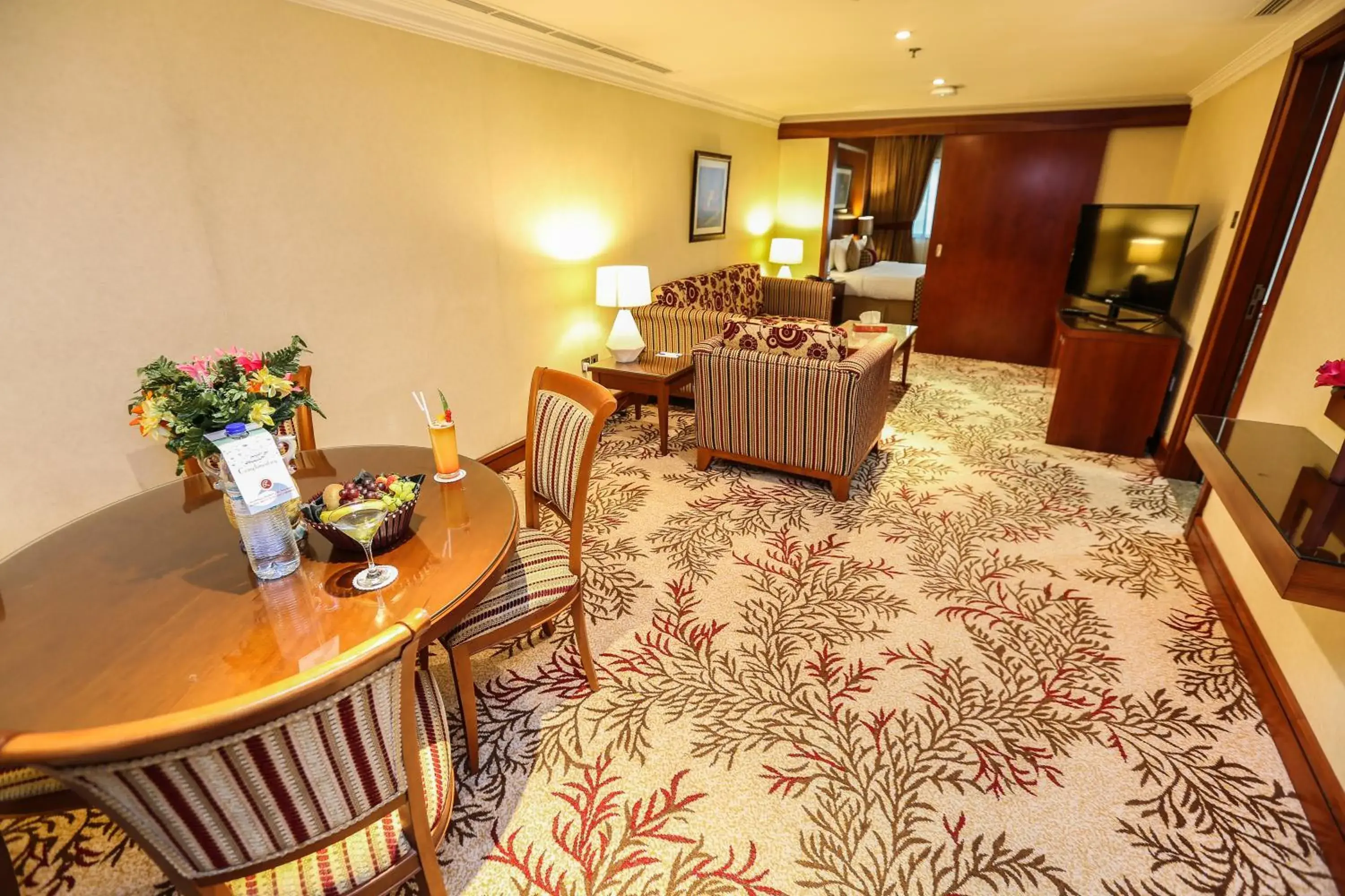 Living room in Ramee Royal Hotel Living room in Ramee Royal Hotel