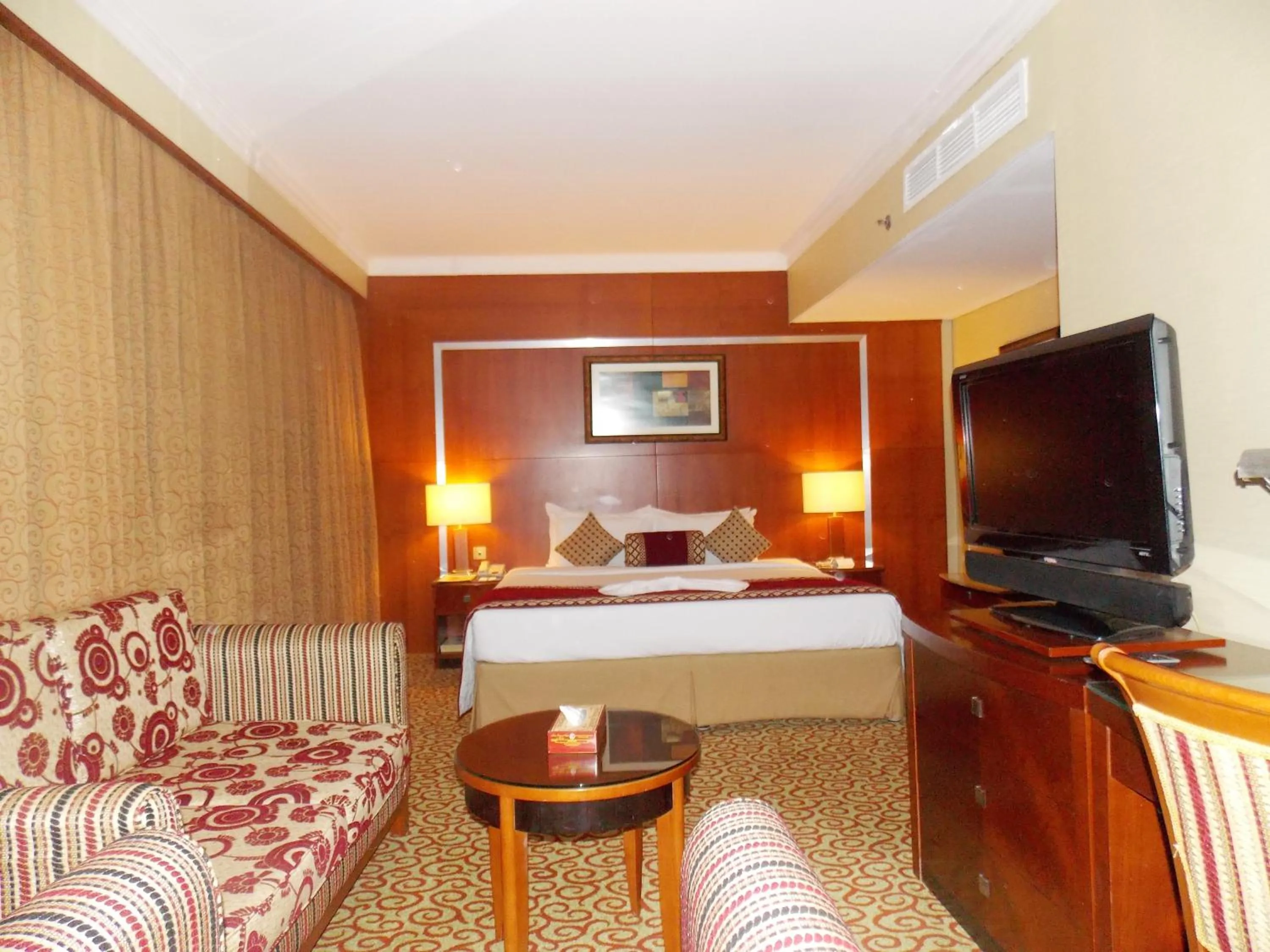 Photo of the whole room, Bed in Ramee Royal Hotel
