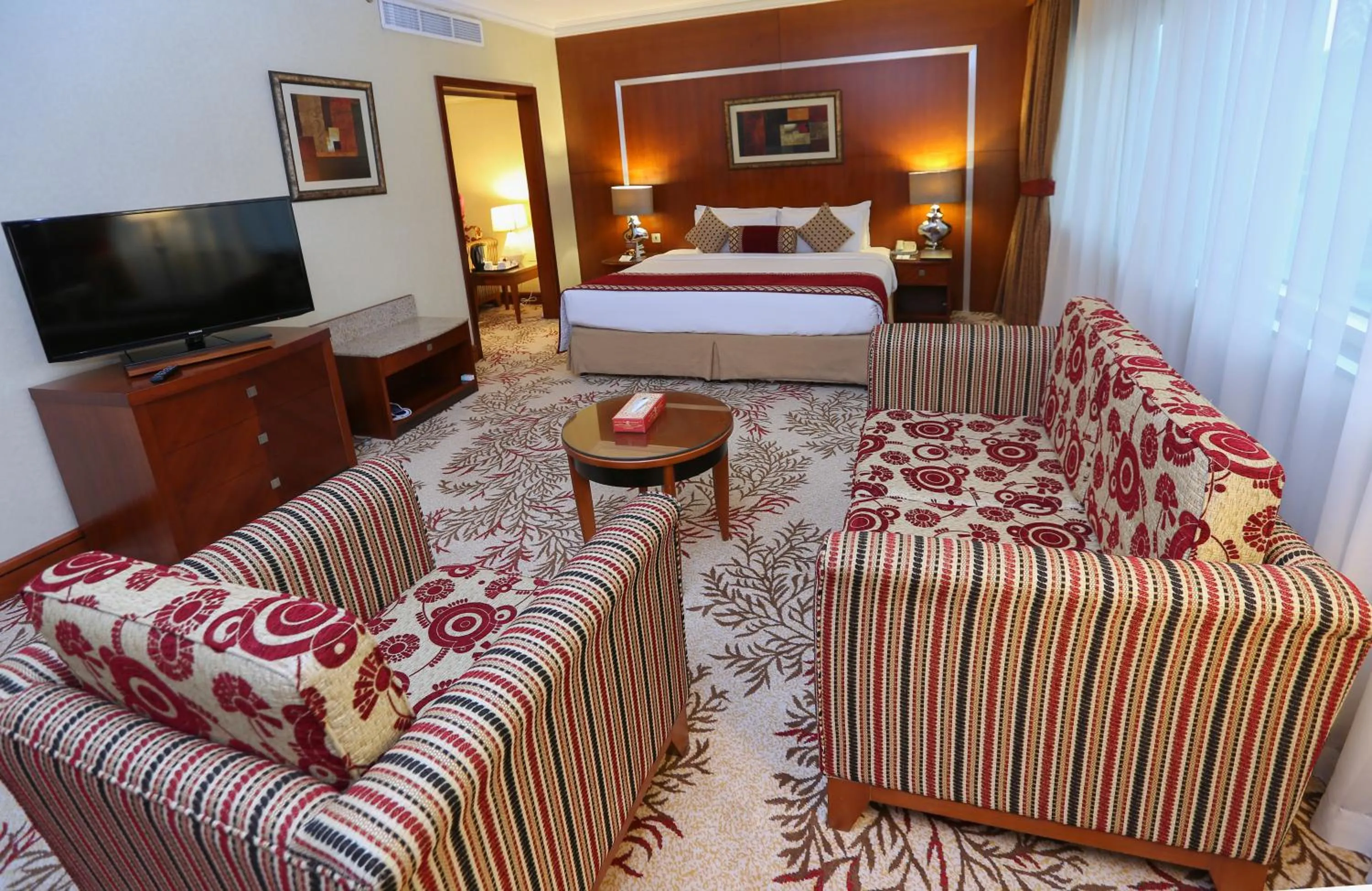 Bed in Ramee Royal Hotel
