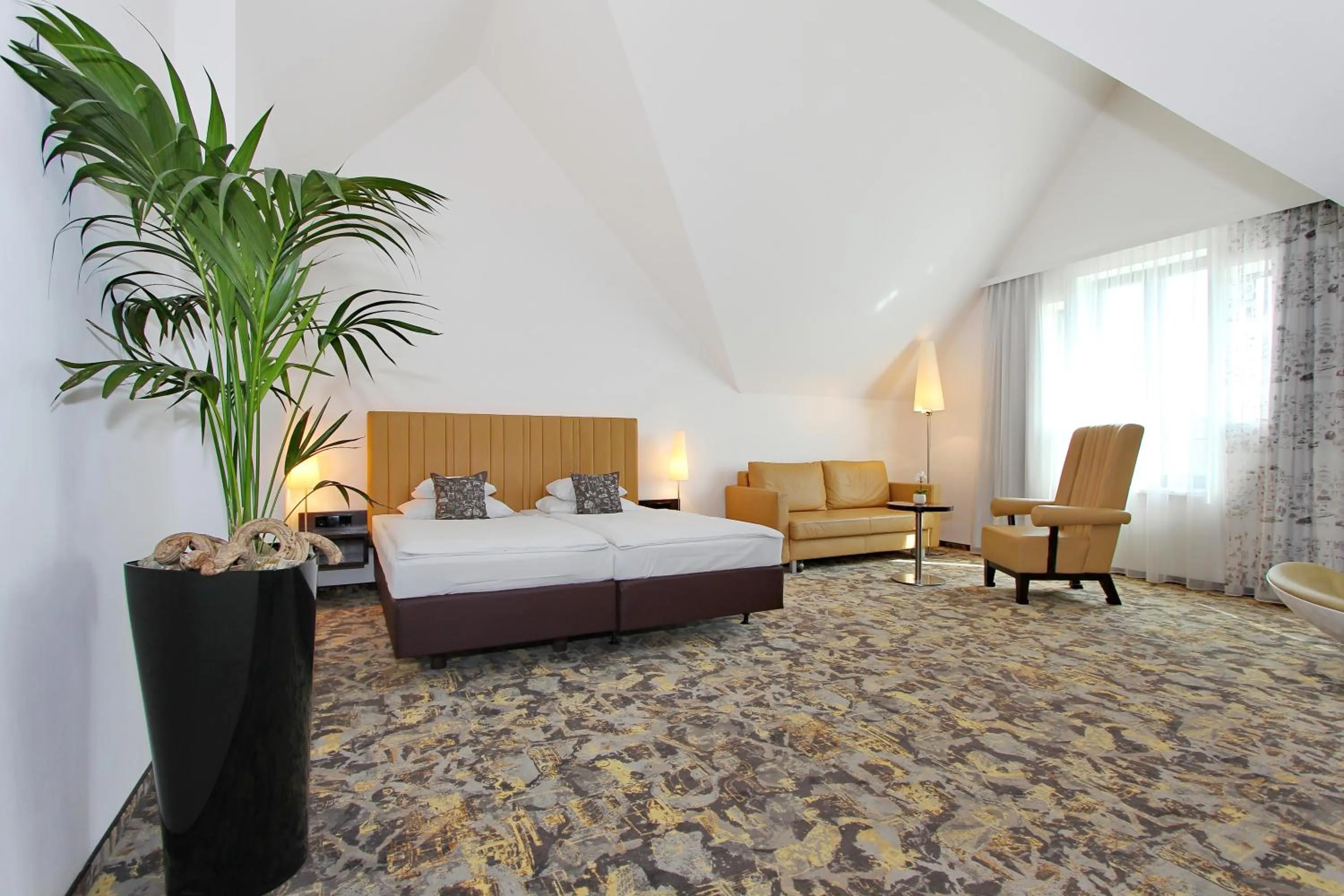 Bed in ARCOTEL Camino Stuttgart