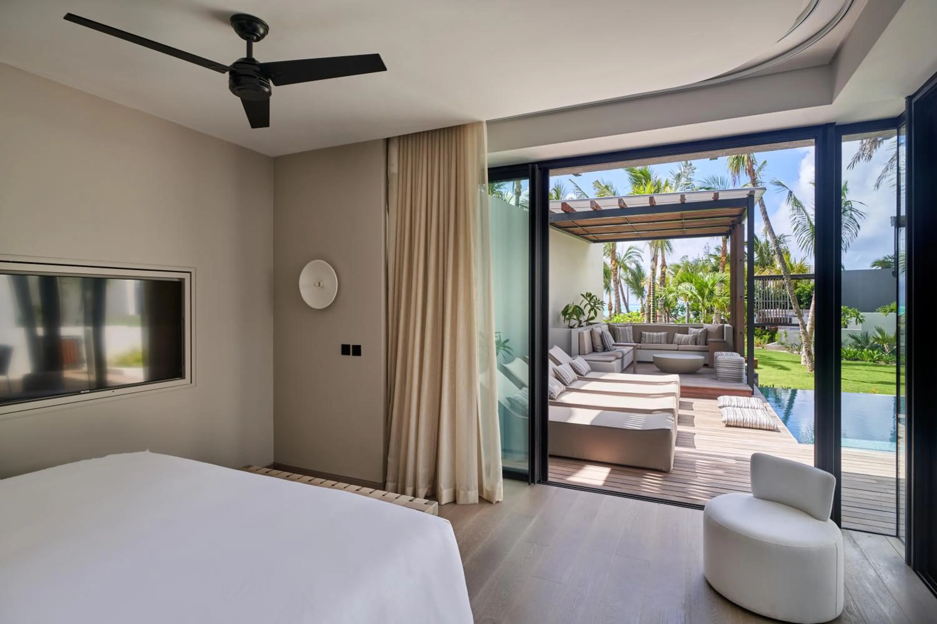 Patio, Bed in LUX* Grand Baie Resort & Residences