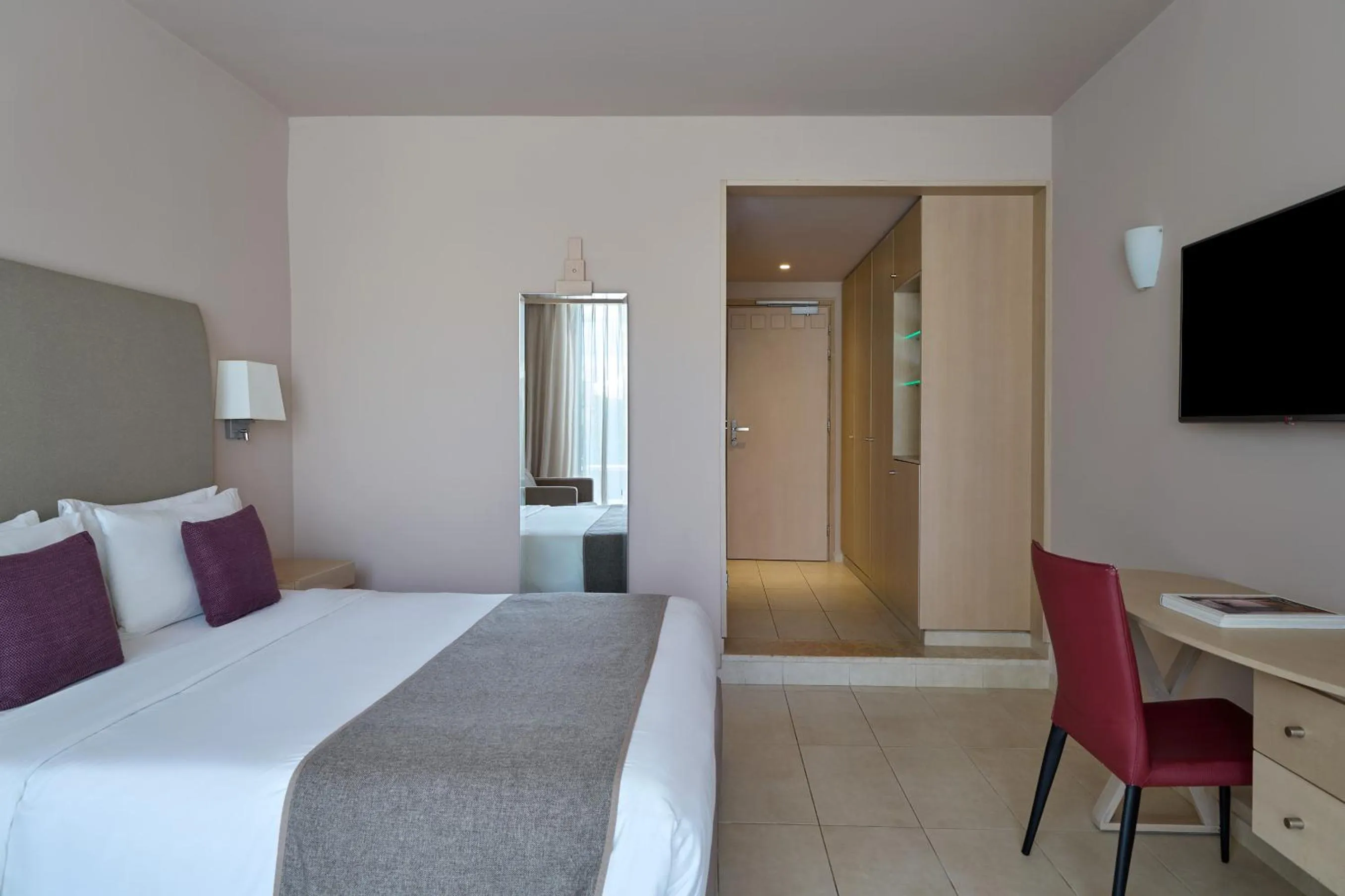 Bed in Atlantica Akti Zeus Hotel